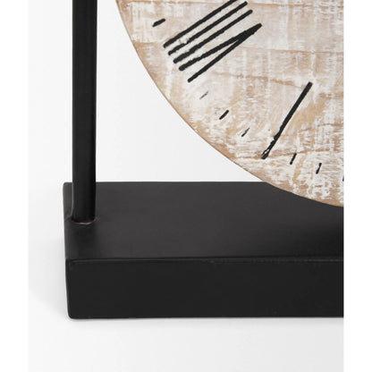 Raja Table Clock by Mercana in black, brown. Made from metal, solid wood in a cottage & farmhouse style.