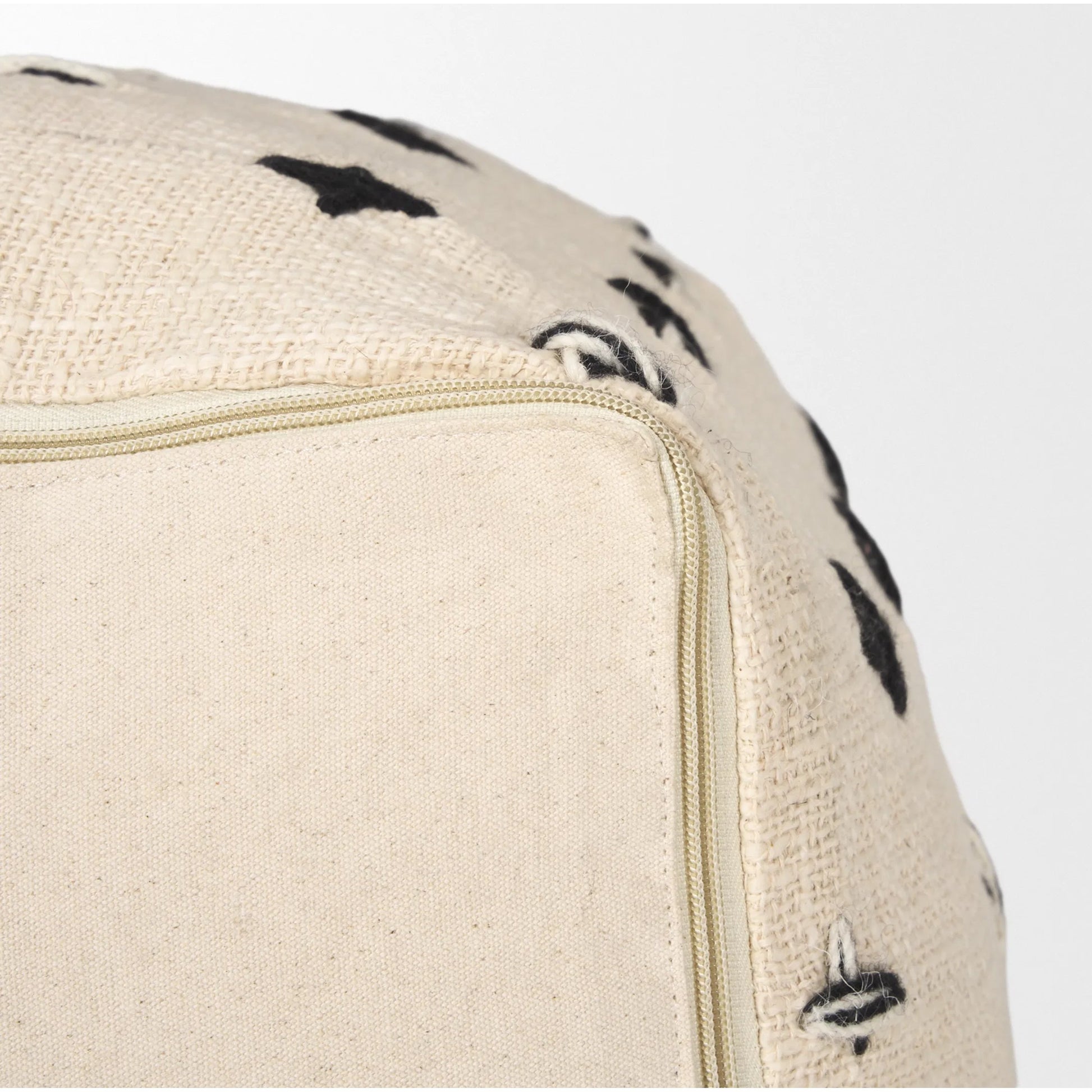 Saanvi Pouf by Mercana in black, cream. Made from wool in a transitional style.