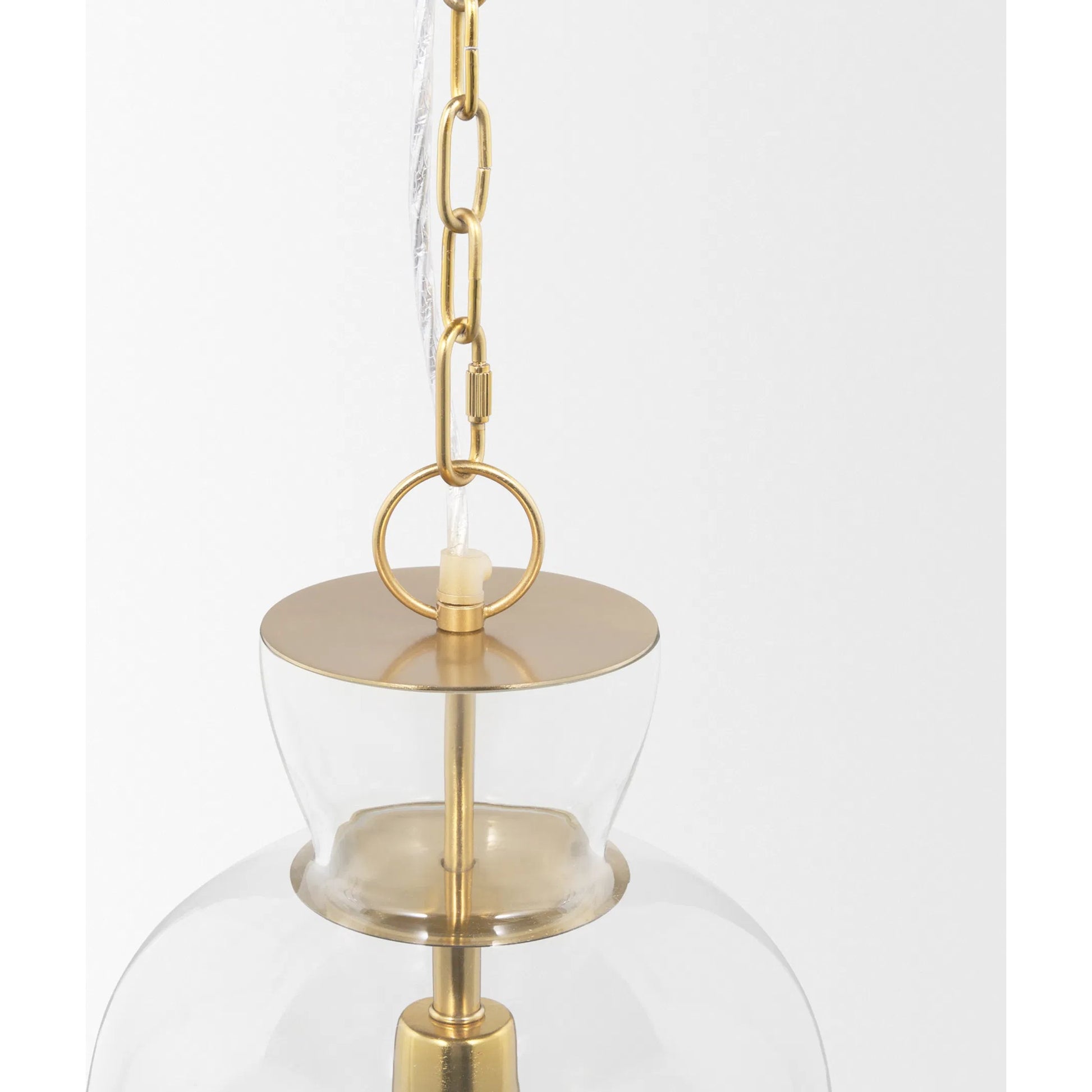 Sadah Pendant Light by Mercana in brushed brass. Made from glass in a transitional style.