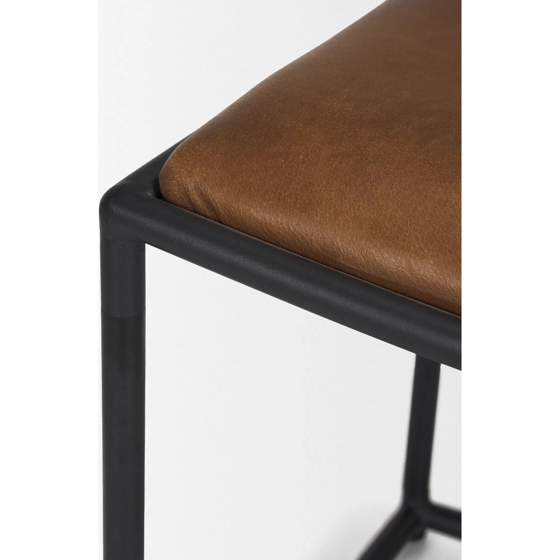 Taniel Leather Stool by Mercana. Made from leather in a traditional style.