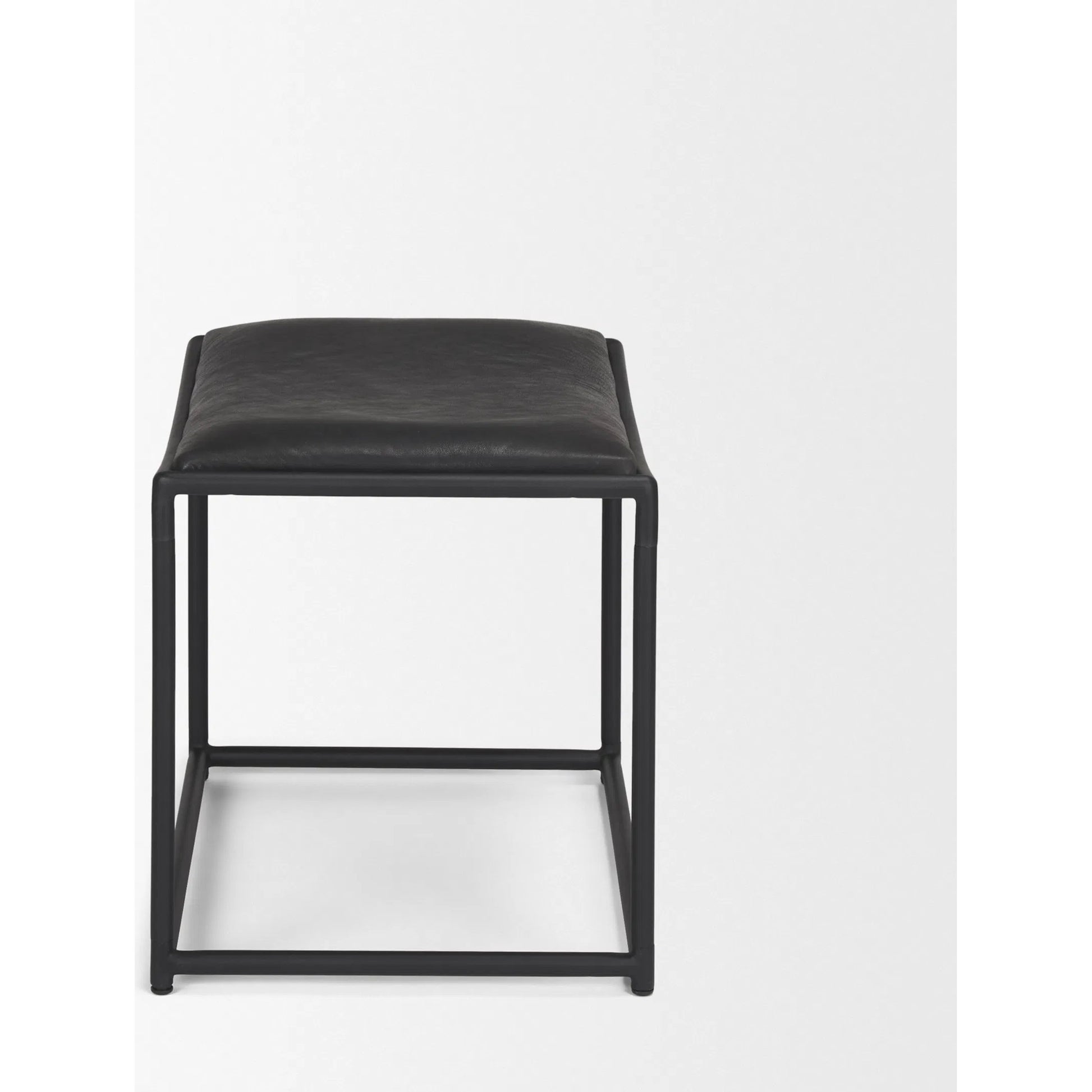 Taniel Leather Stool by Mercana. Made from leather in a traditional style.
