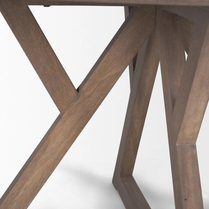 Jennings Dining Table by Mercana in brown. Made from solid wood in a modern style.