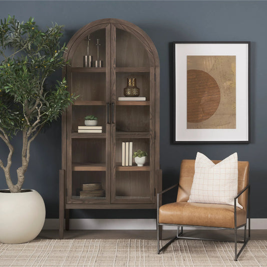 Teva Curio Cabinet by Mercana in medium brown. Made from manufactured wood in a unique style.
