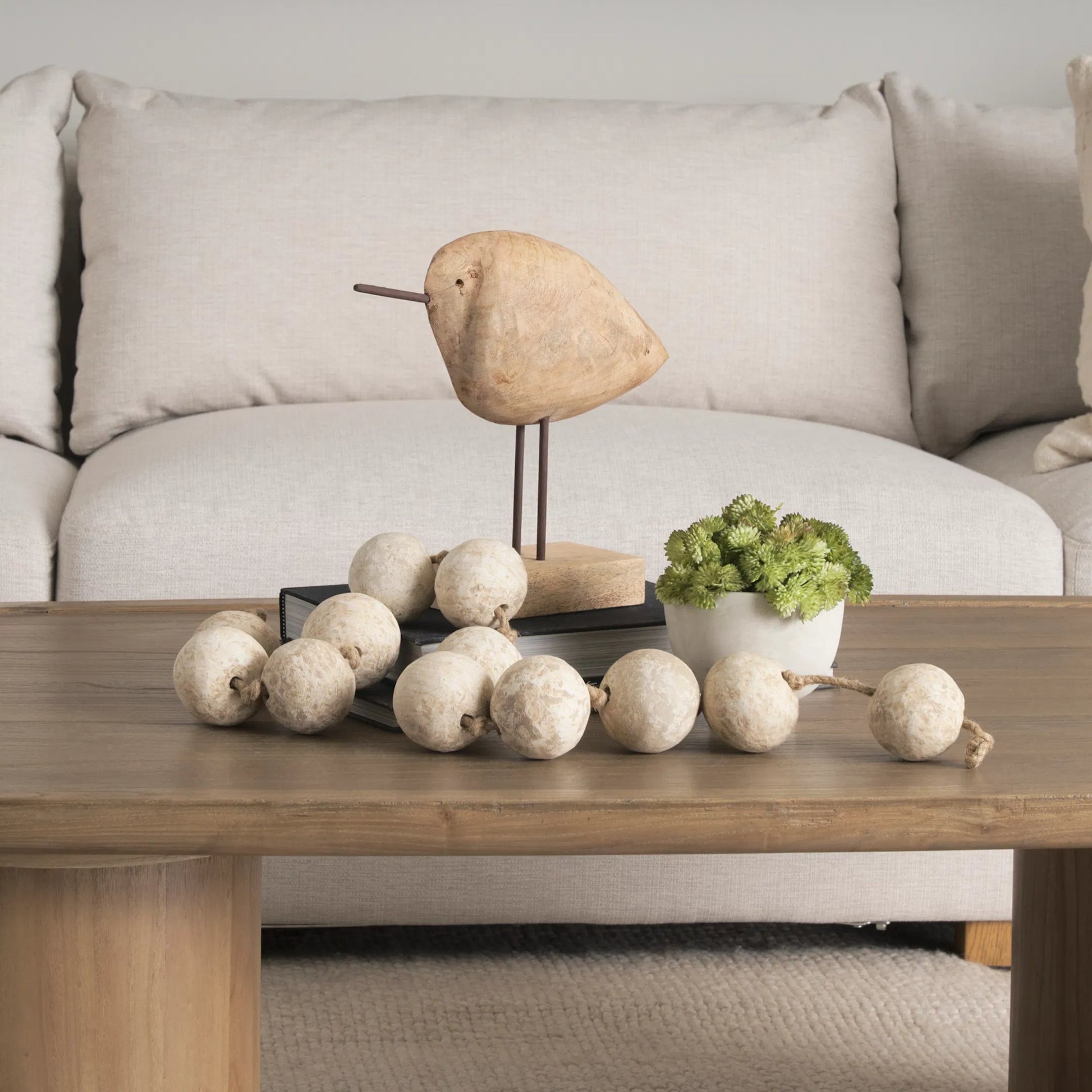 Riri Wooden Bird Decorative Object by Mercana in brown. Made from solid wood in a unique style.