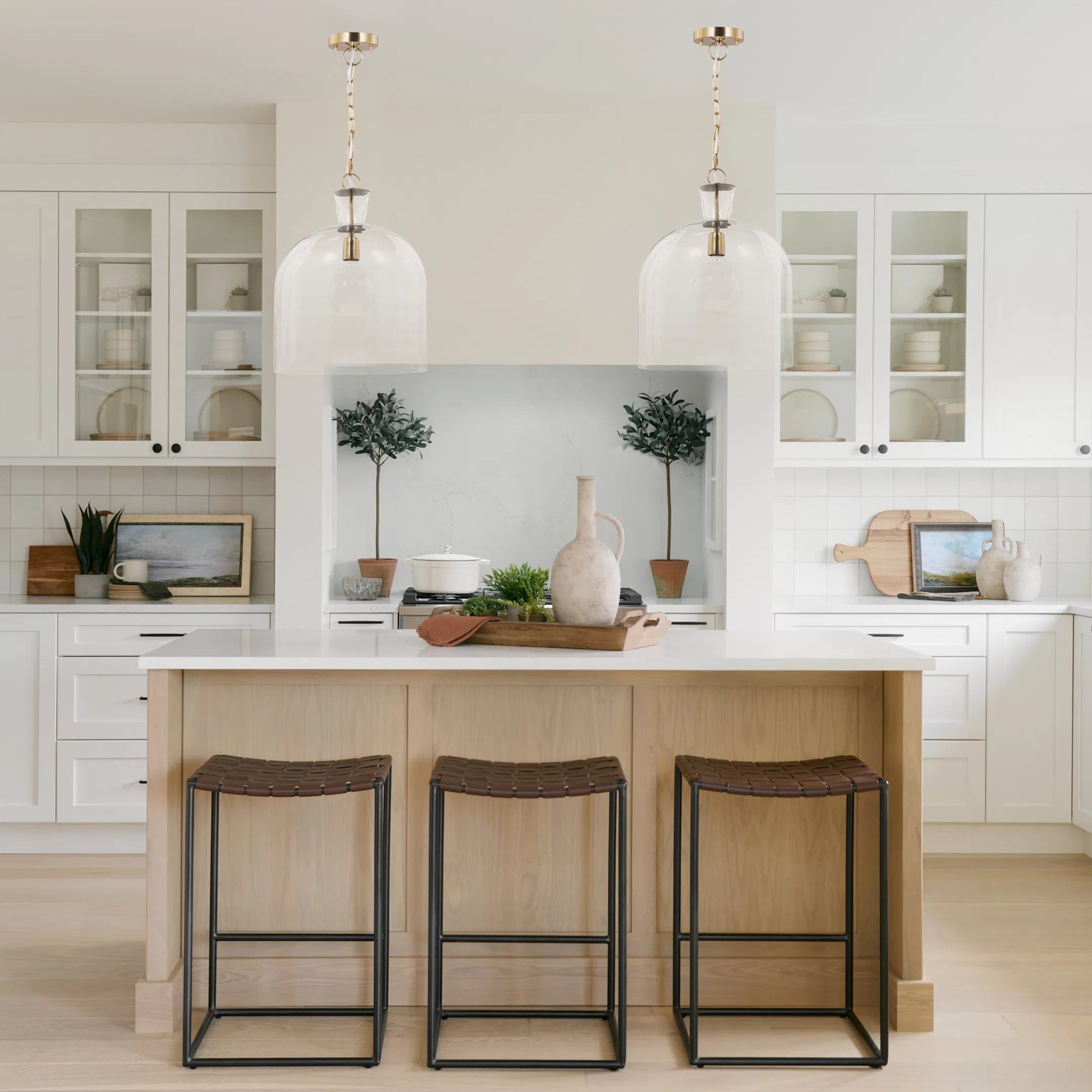 Sadah Pendant Light by Mercana in brushed brass. Made from glass in a transitional style.