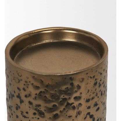Akira Hammered Gold Pillar Candle Holder by Mercana in antiqued gold. Made from metal in a rustic style.
