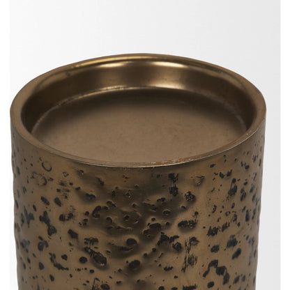 Akira Hammered Gold Pillar Candle Holder by Mercana in antiqued gold. Made from metal in a rustic style.