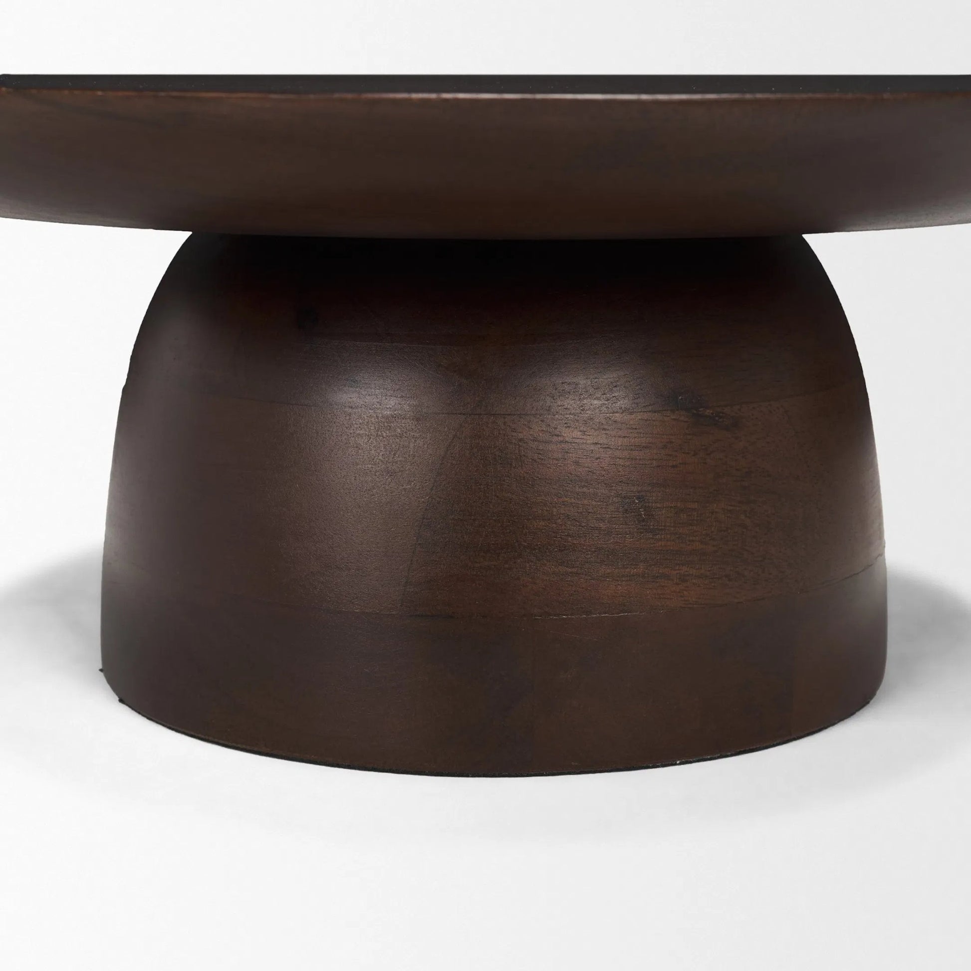 Sadira Mid-Dark Brown Round Riser by Mercana in medium brown. Made from solid wood in a unique style.