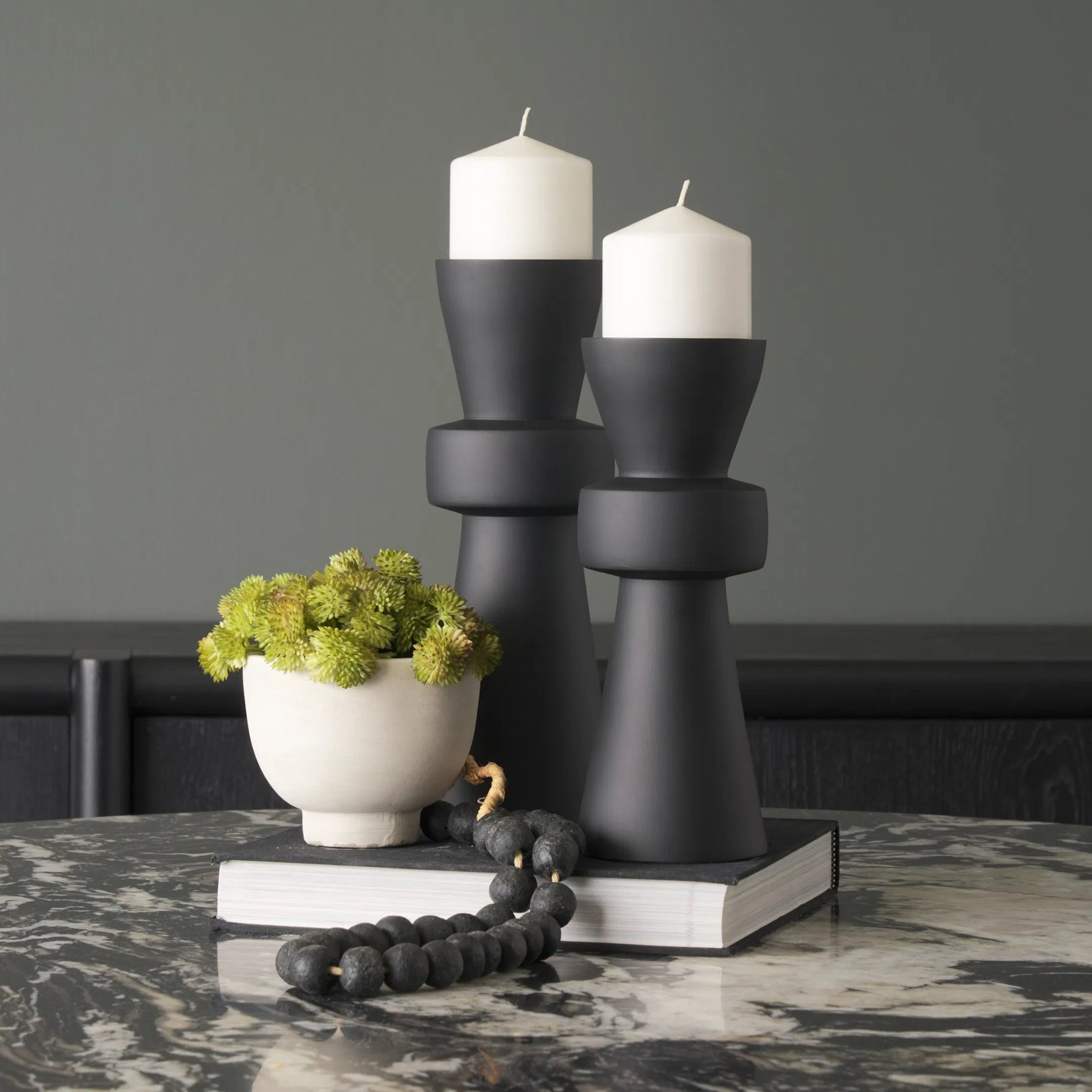 Odilia Geometric Pillar Candle Holder by Mercana. Made from metal in a unique style.