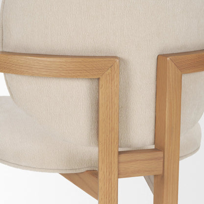 Carlisle Fabric Dining Armchair by Mercana in cream, brown. Made from solid wood in a transitional style.