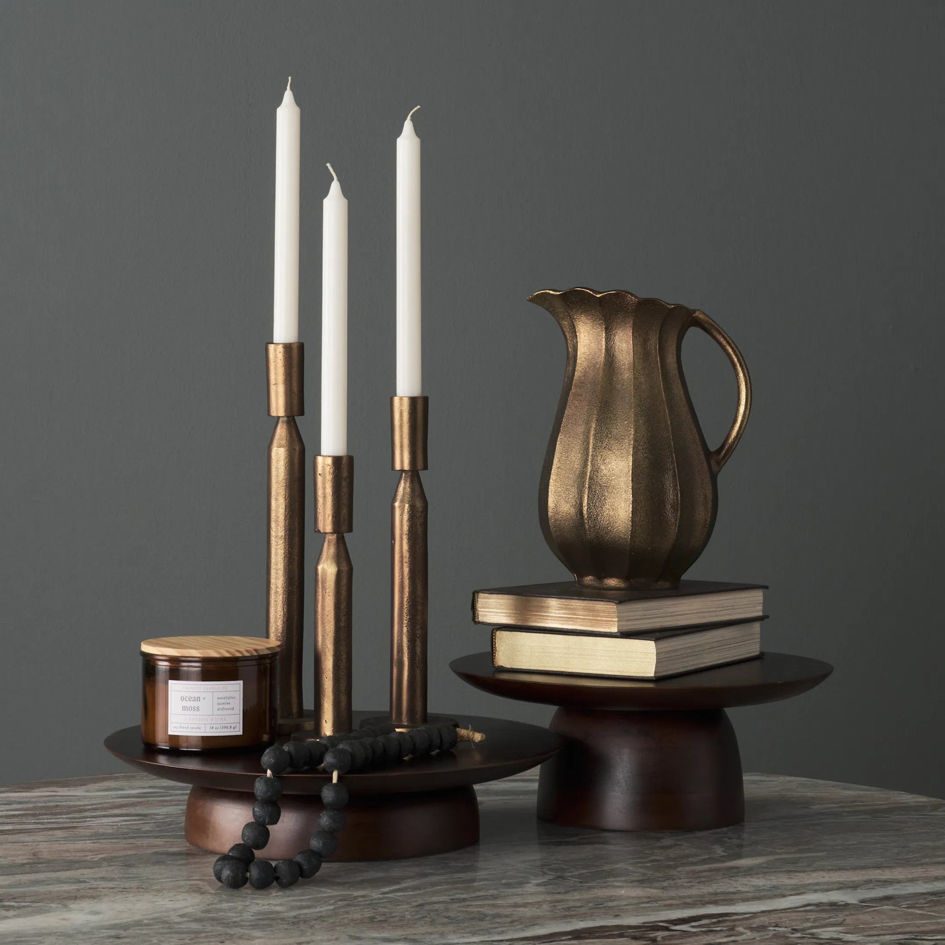 Sadira Mid-Dark Brown Round Riser by Mercana in medium brown. Made from solid wood in a unique style.
