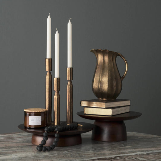 Sadira Mid-Dark Brown Round Riser by Mercana in medium brown. Made from solid wood in a unique style.