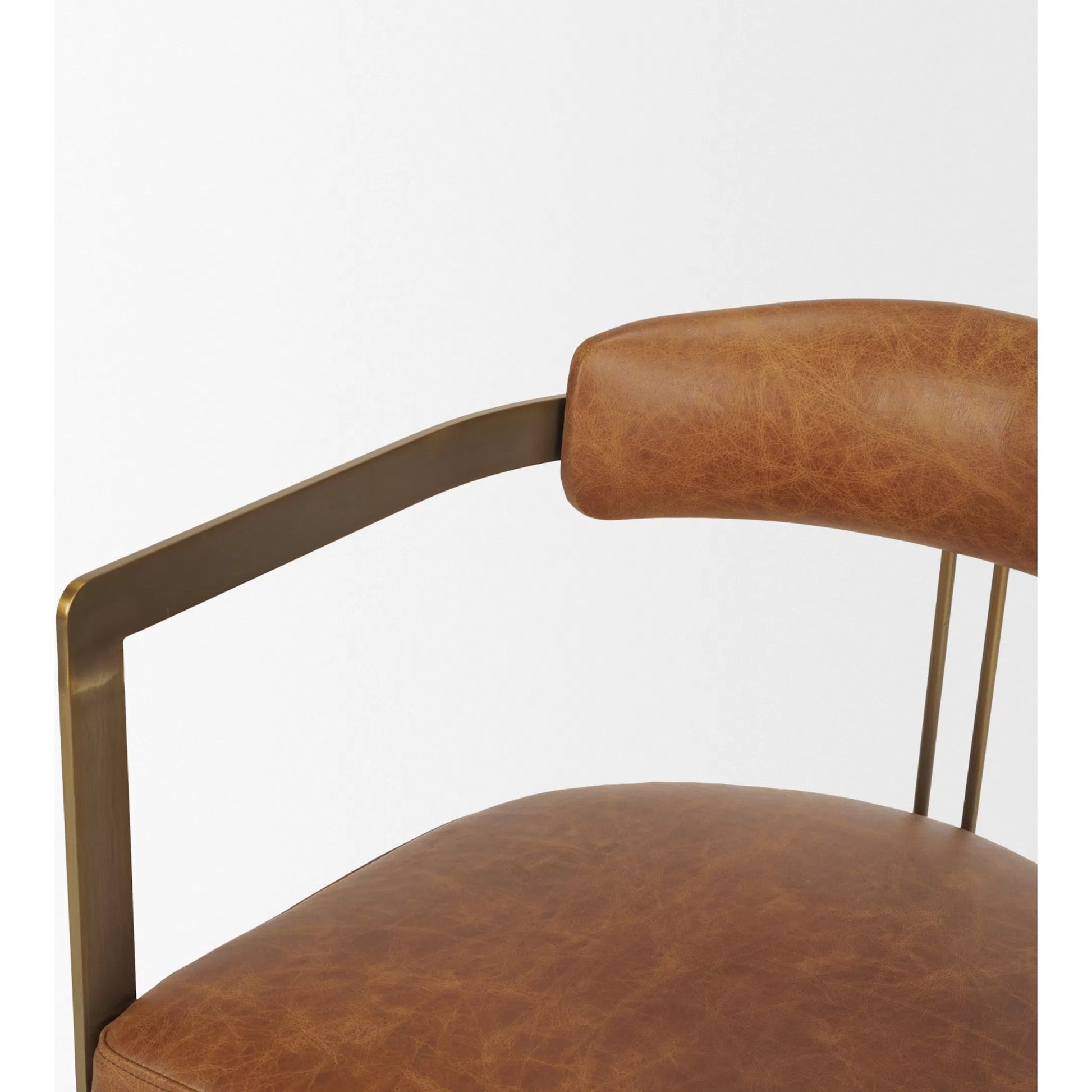 Hollyfield Leather Dining Armchair by Mercana. Made from metal in a traditional style.