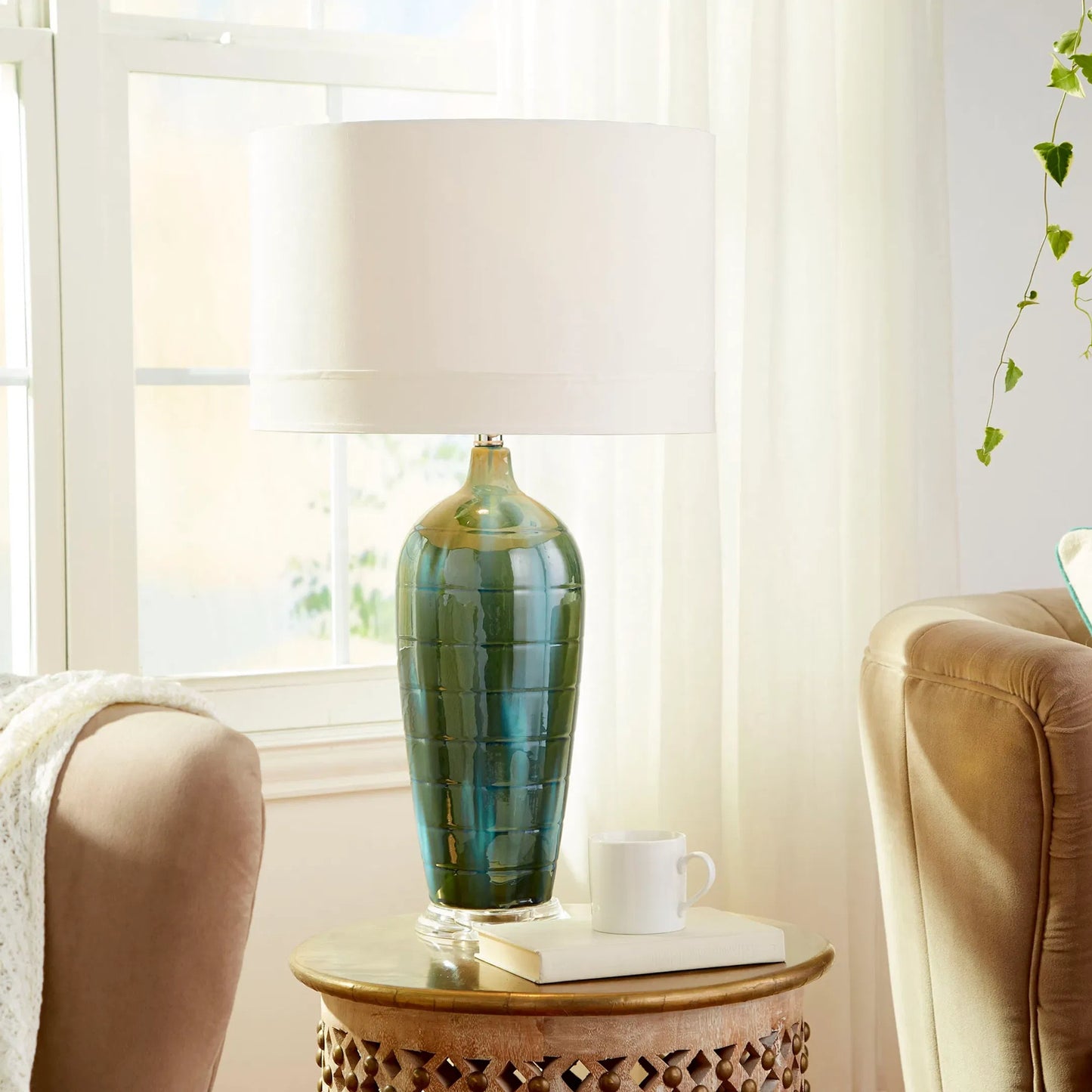 002 S-255463 | Lifestyle | Elysia Table Lamp by Cyan Design in blue glaze. Made from ceramic with white silk shade with white lining in a modern style.