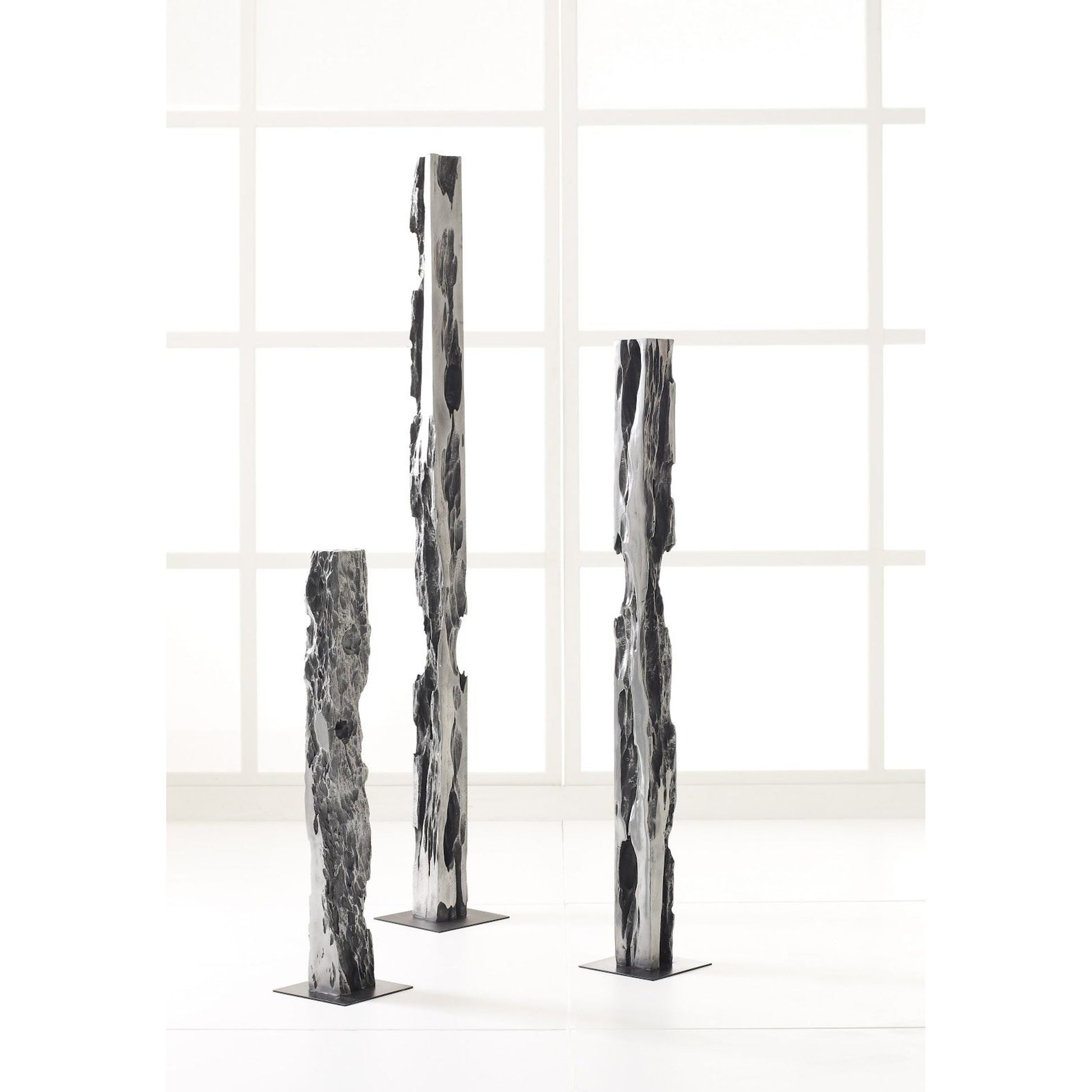 Plinth by Phillips Collection in gray. Made from resin in a eclectic & global style.
