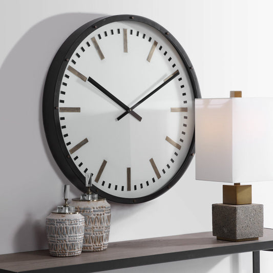 Fleming Wall Clock by Uttermost. Made from iron, glass in a transitional style.