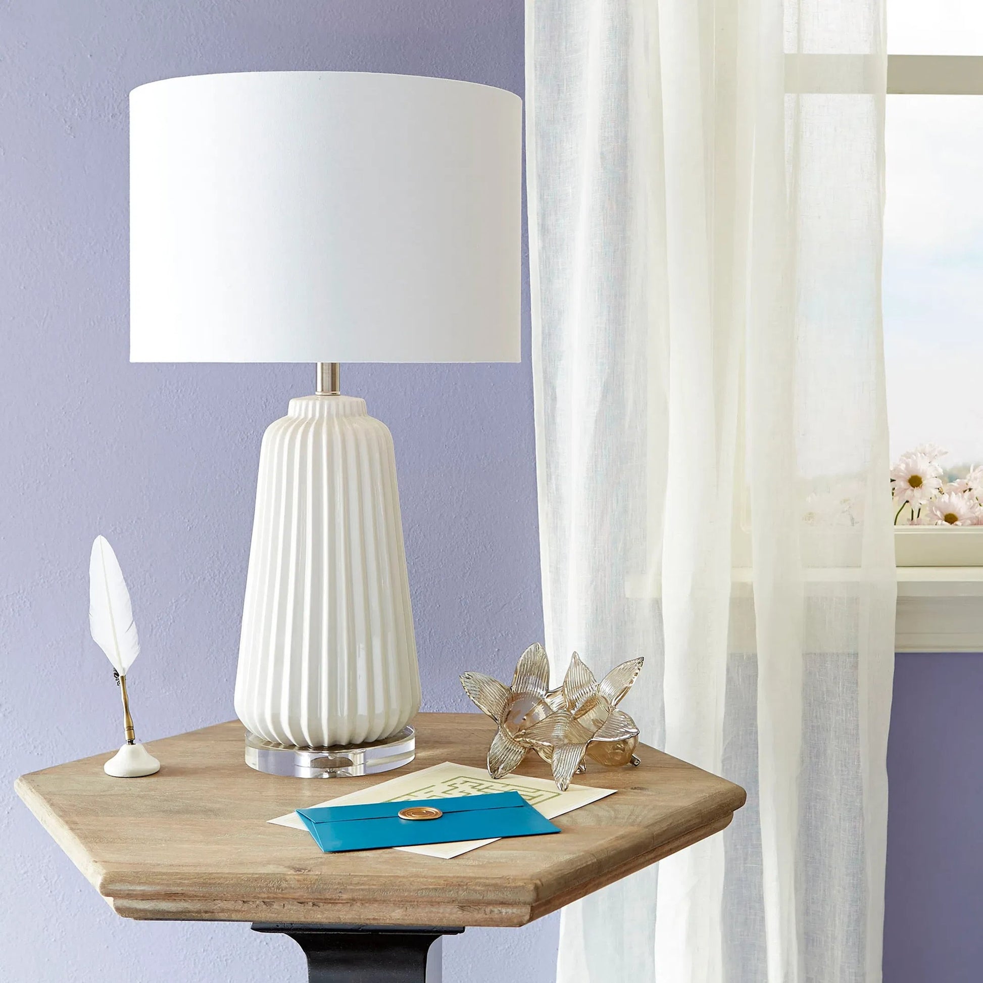 Delphine Table Lamp by Cyan Design in white. Made from ceramic, crystal base, white linen shade, white lining in a modern style.