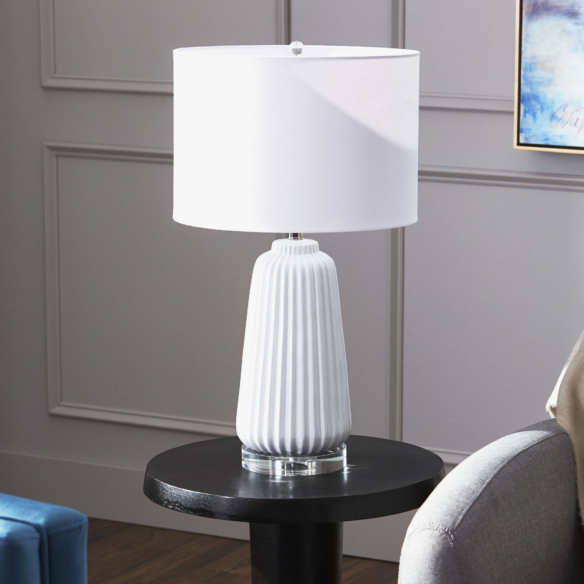 Delphine Table Lamp by Cyan Design in white. Made from ceramic, crystal base, white linen shade, white lining in a modern style.