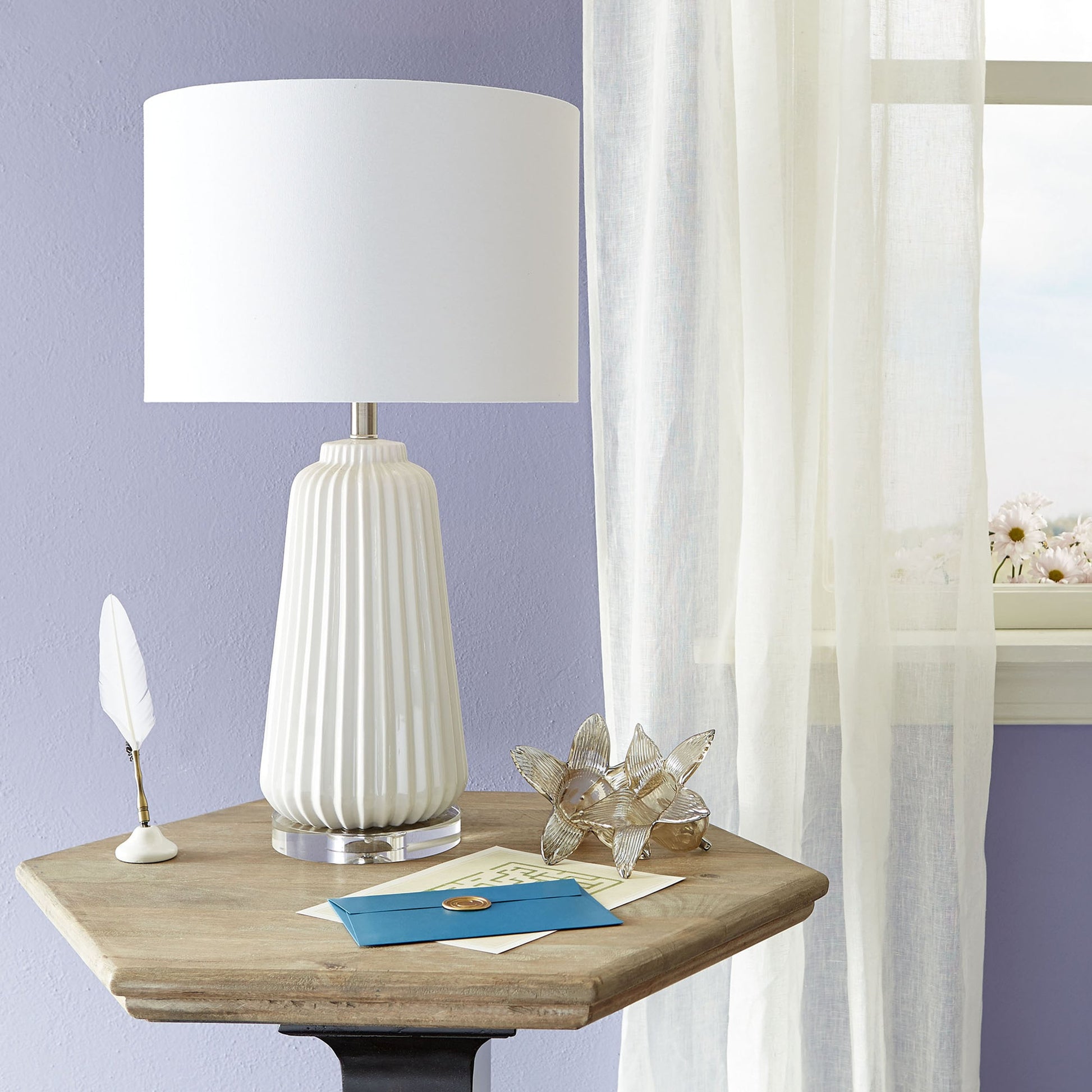 Delphine Table Lamp by Cyan Design in white. Made from ceramic, crystal base, white linen shade, white lining in a modern style.