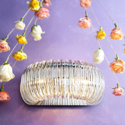 Beaming Around Wall Sconce by Cyan Design in chrome. Made from glass, iron in a modern style.