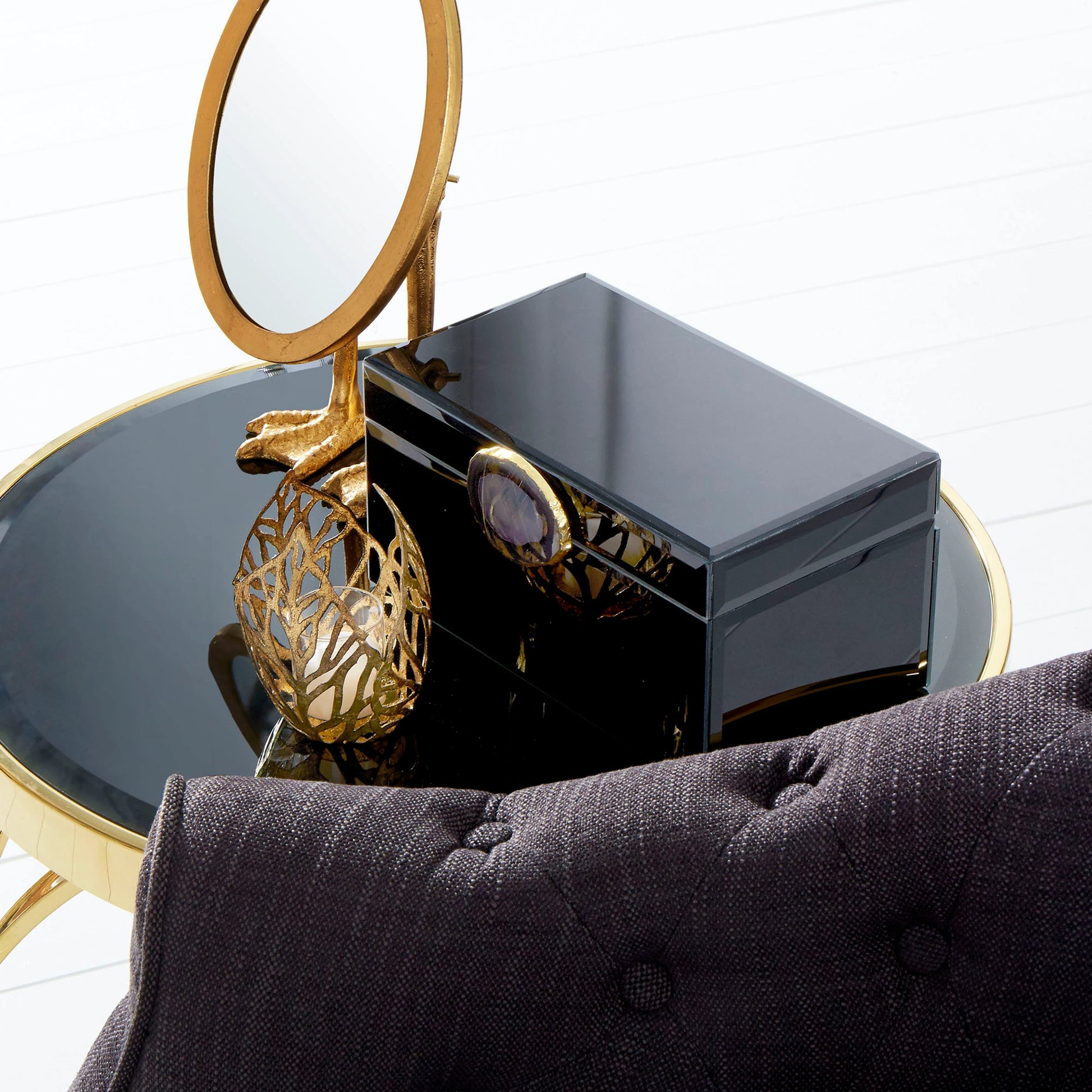 Sunrise Flame Candleholder by Cyan Design in antique gold. Made from iron, glass in a modern style.
