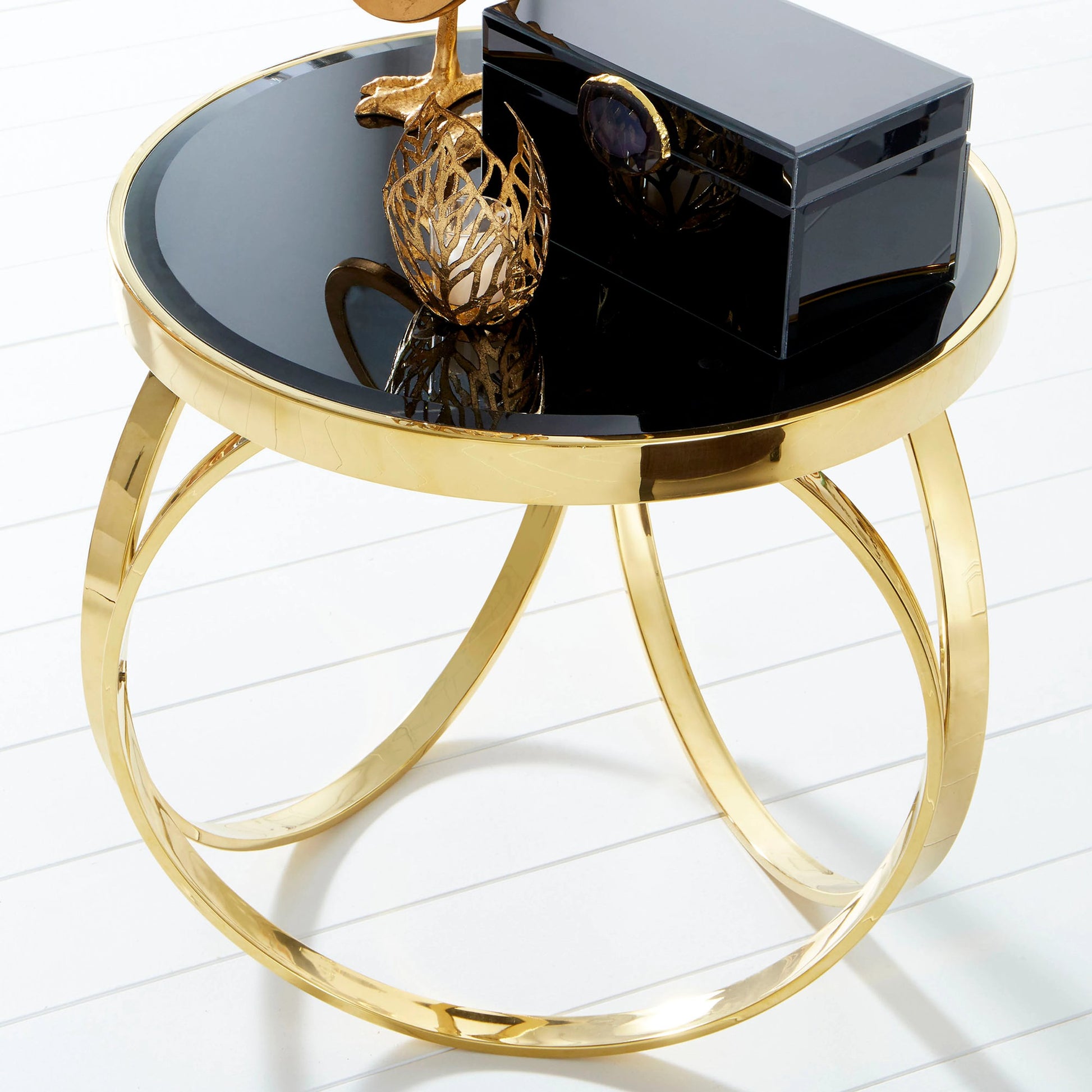 Sunrise Flame Candleholder by Cyan Design in antique gold. Made from iron, glass in a modern style.