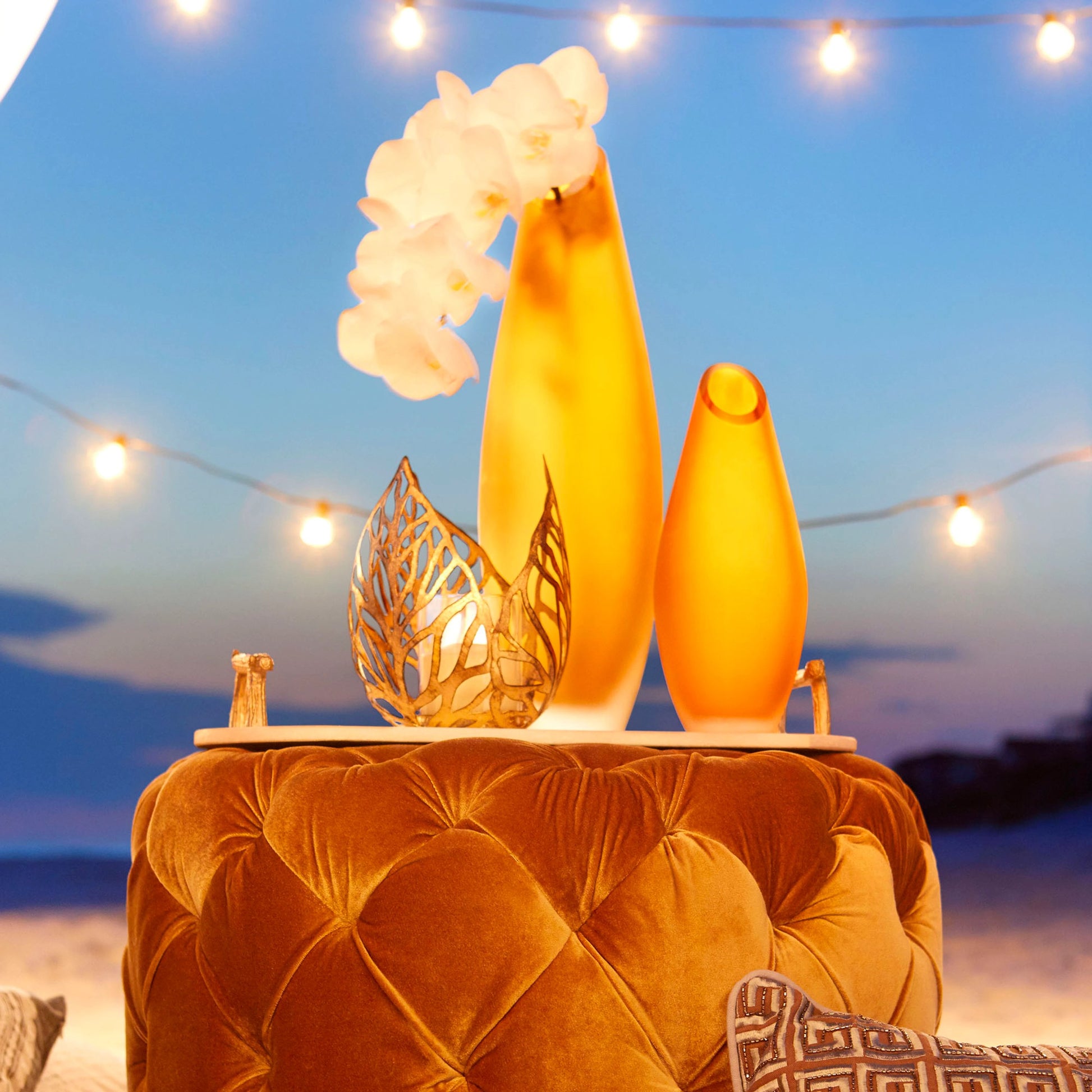 Sunrise Flame Candleholder by Cyan Design in antique gold. Made from iron, glass in a modern style.