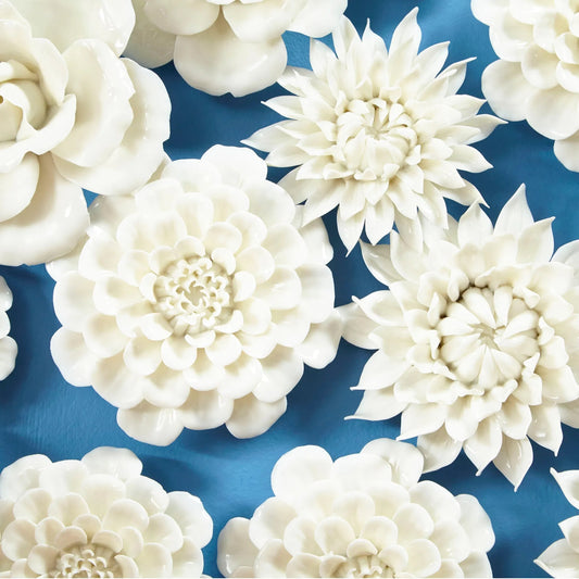 Flourishing Flowers Wall Decor by Cyan Design in off white glaze. Made from ceramic in a modern style.