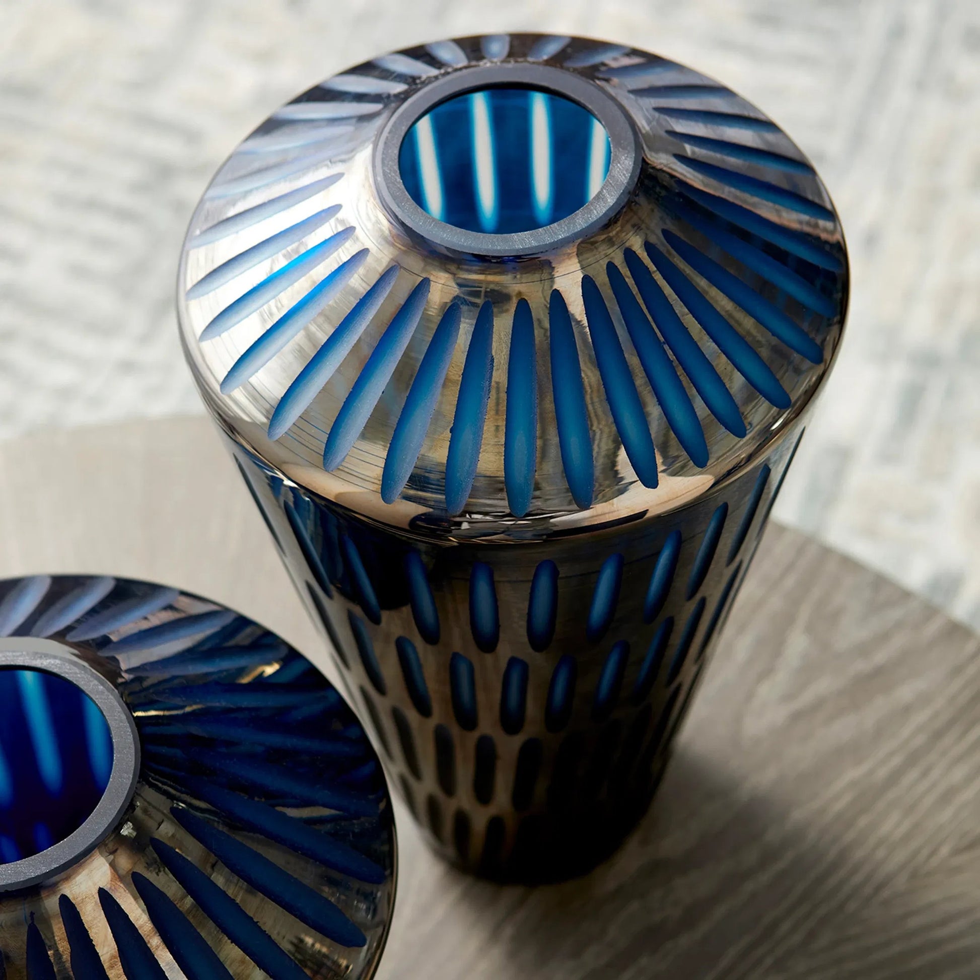 Toreen Vase by Cyan Design in blue. Made from glass in a modern style.