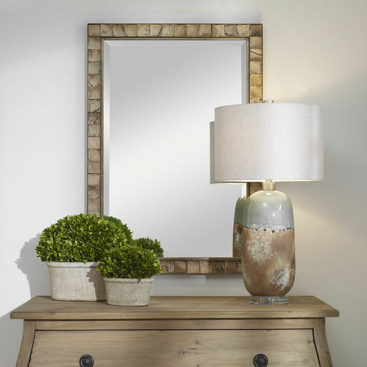 Cocos Mirror by Uttermost in dark gold. Made from iron, glass coconut shell, mdf in a transitional style.