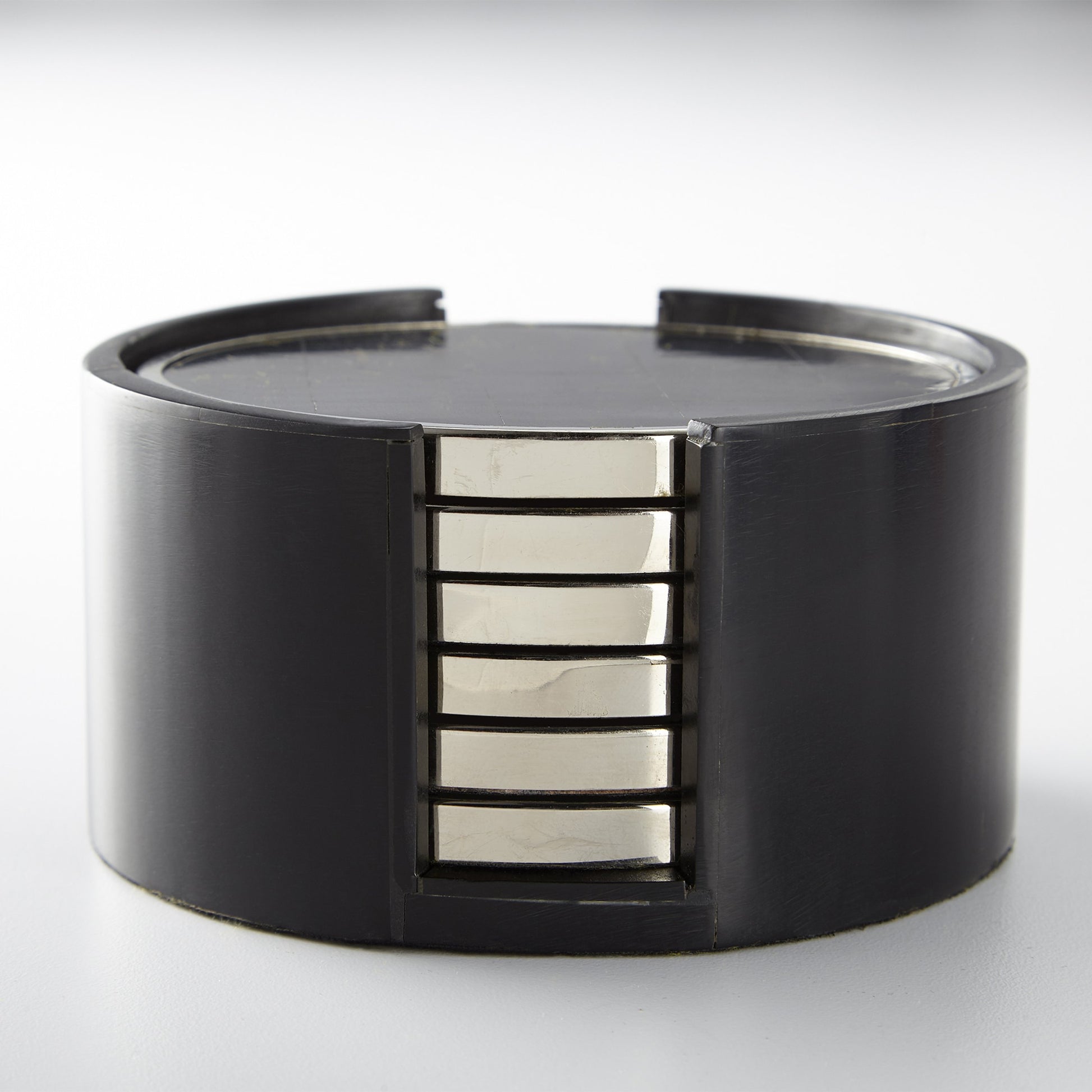 Jameson Coasters by Cyan Design in nickel, black. Made from resin, wood, brass in a modern style.