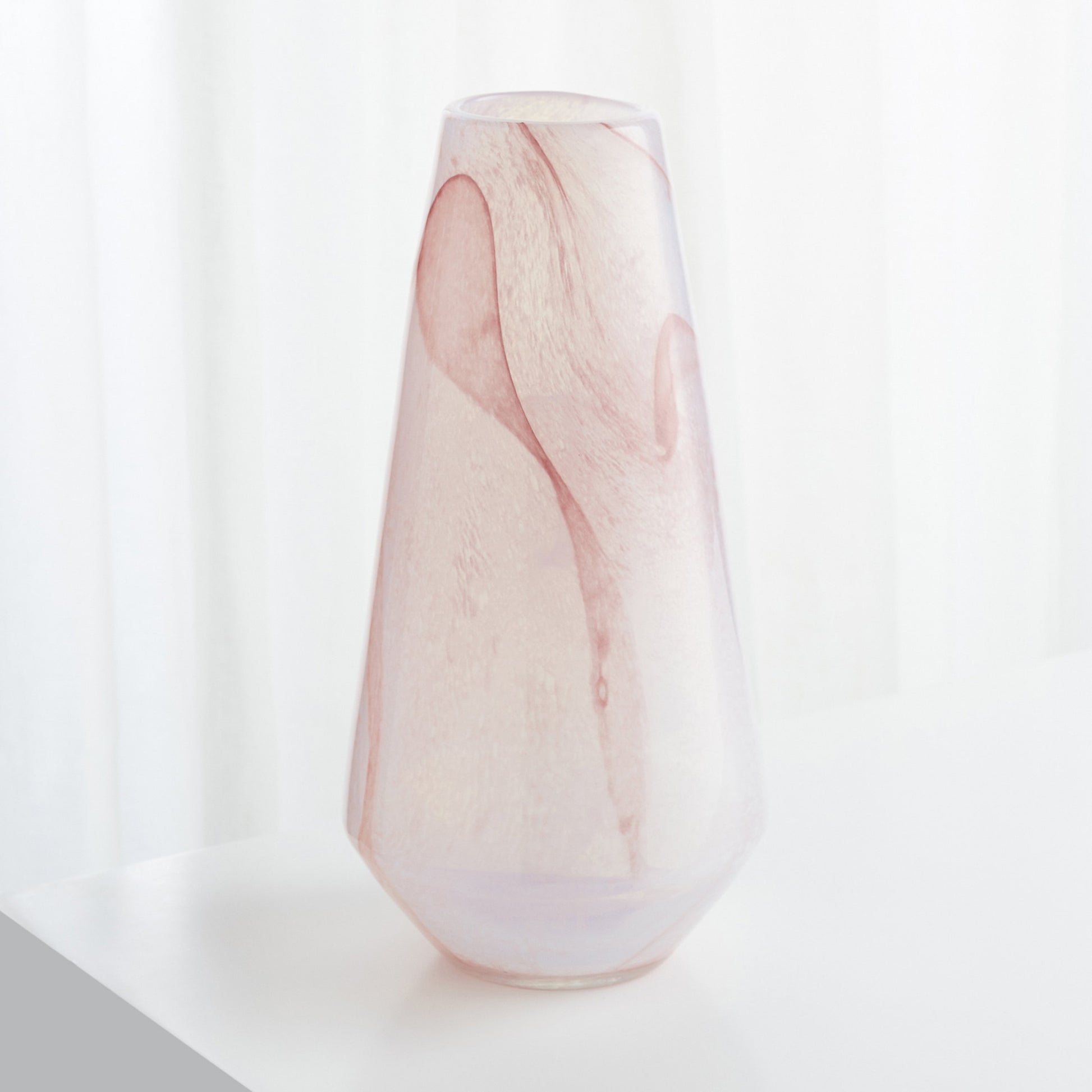 Atria Narrow Vase by Cyan Design in pink. Made from glass in a modern style.