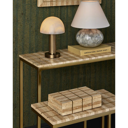 Dezi Console Table by Currey and Company in natural, brass. Made from travertine, brass, iron in a transitional style.