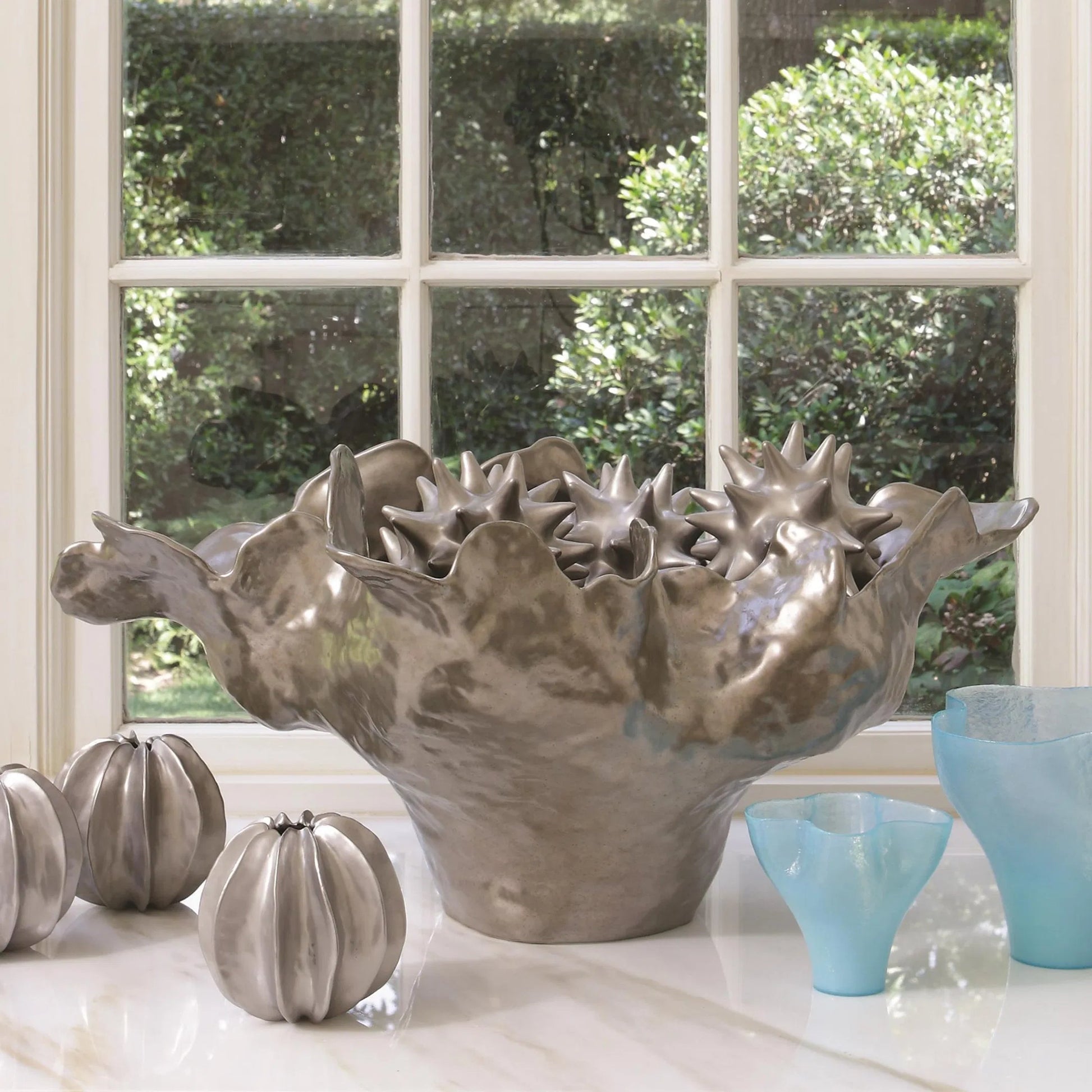 Meteor Bowl by Global Views. Made from ceramic in a coastal style.