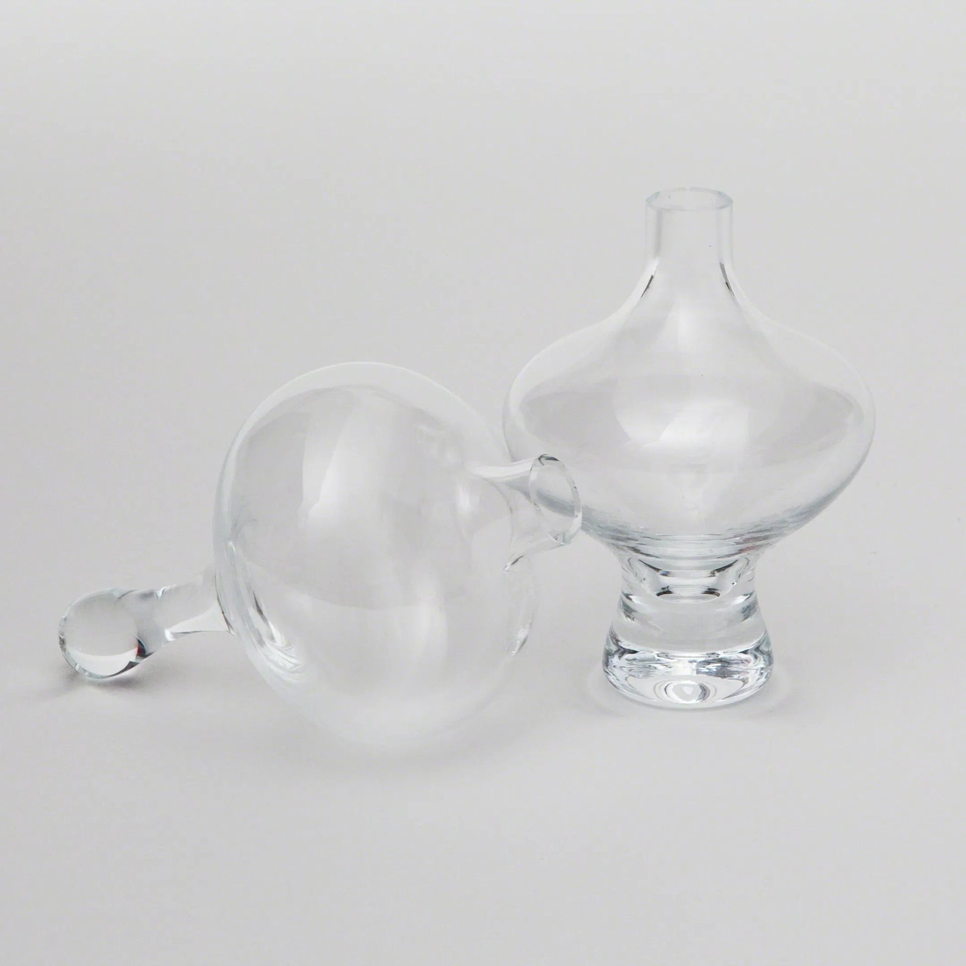 Mini Floating Droplet Vase by Global Views. Made from glass in a modern style.