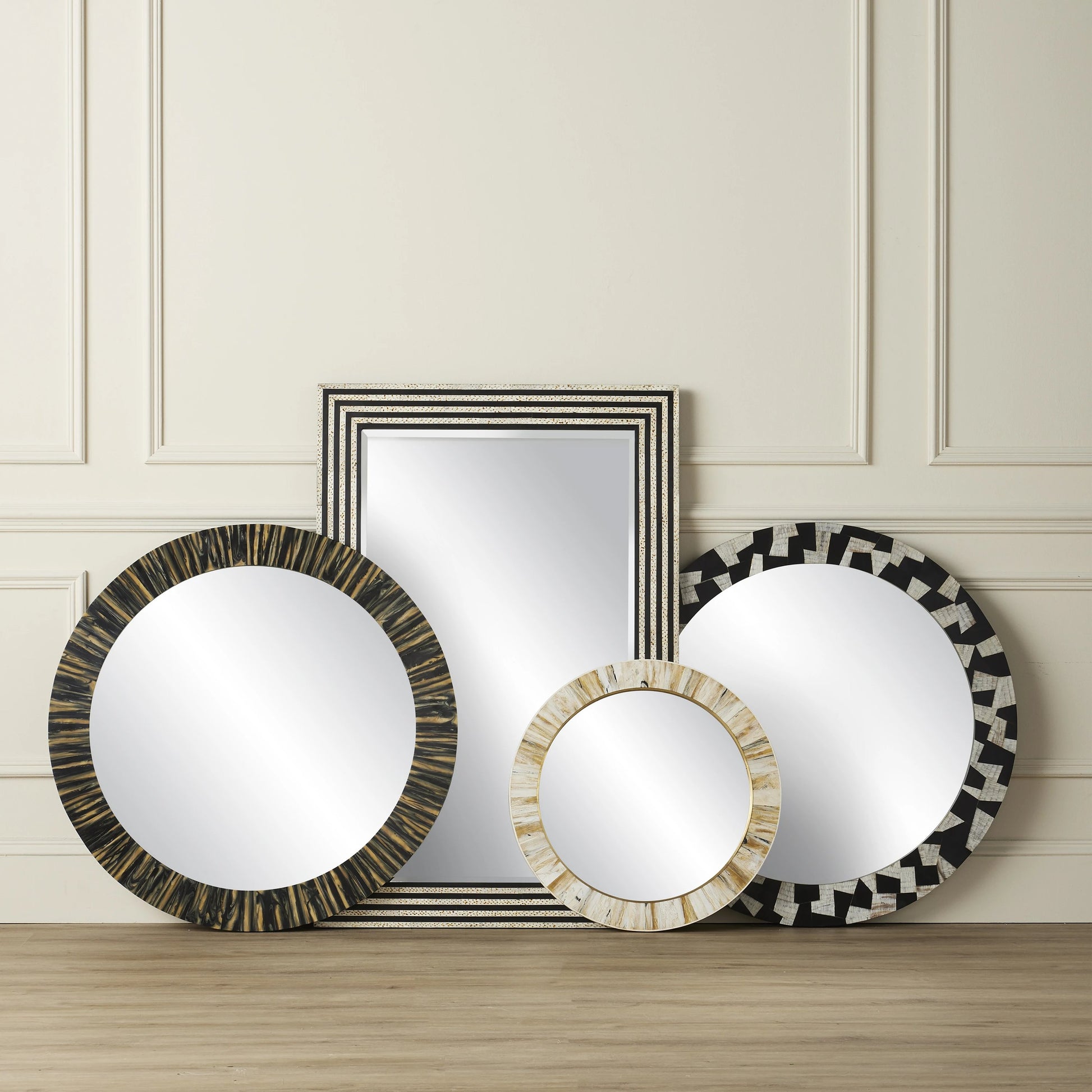 Niva Round Wall Mirror by Currey and Company in cream, brass, mirror. Made from composite, brass, glass, engineered hardwood in a modern style.