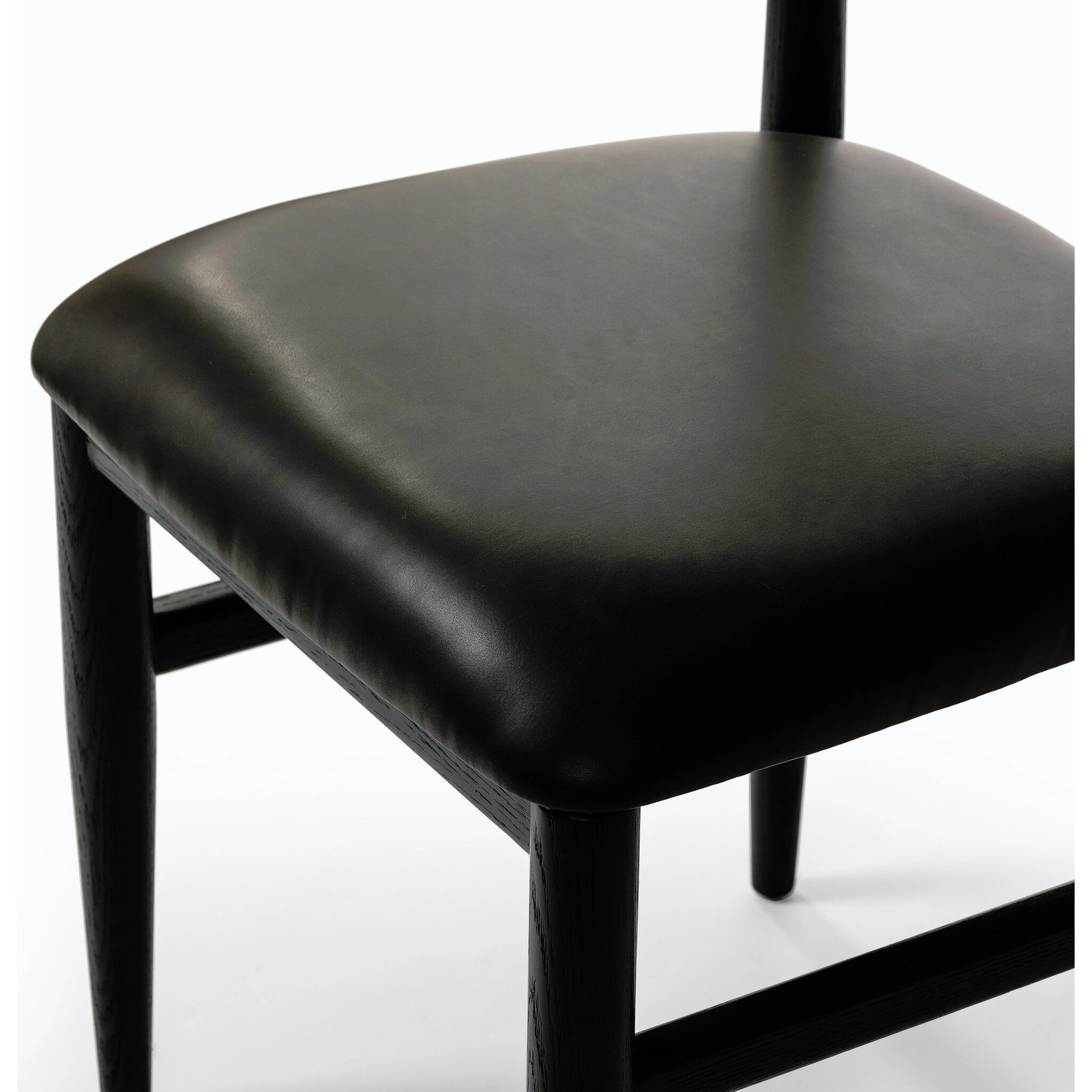 Mavery Armless Dining Chair by Four Hands in sierra espresso, brushed ebony oak, brushed ebony oak veneer. Made from faux leather, solid oak, oak veneer in a modern style.