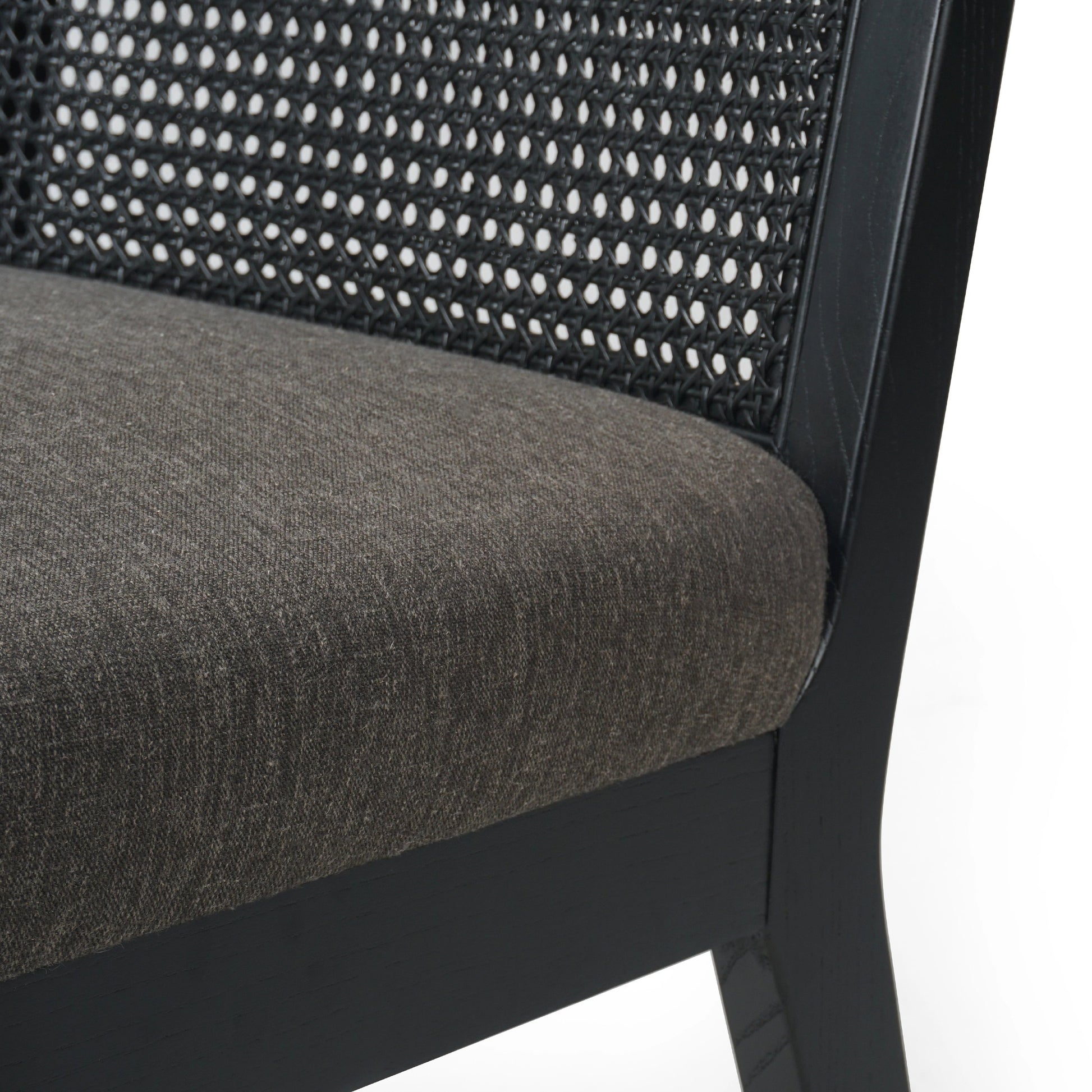 Antonia Cane Dining Chair by Four Hands in brushed ebony, sonoma black. Made from top grain leather, solid nettlewood, cane in a modern style.
