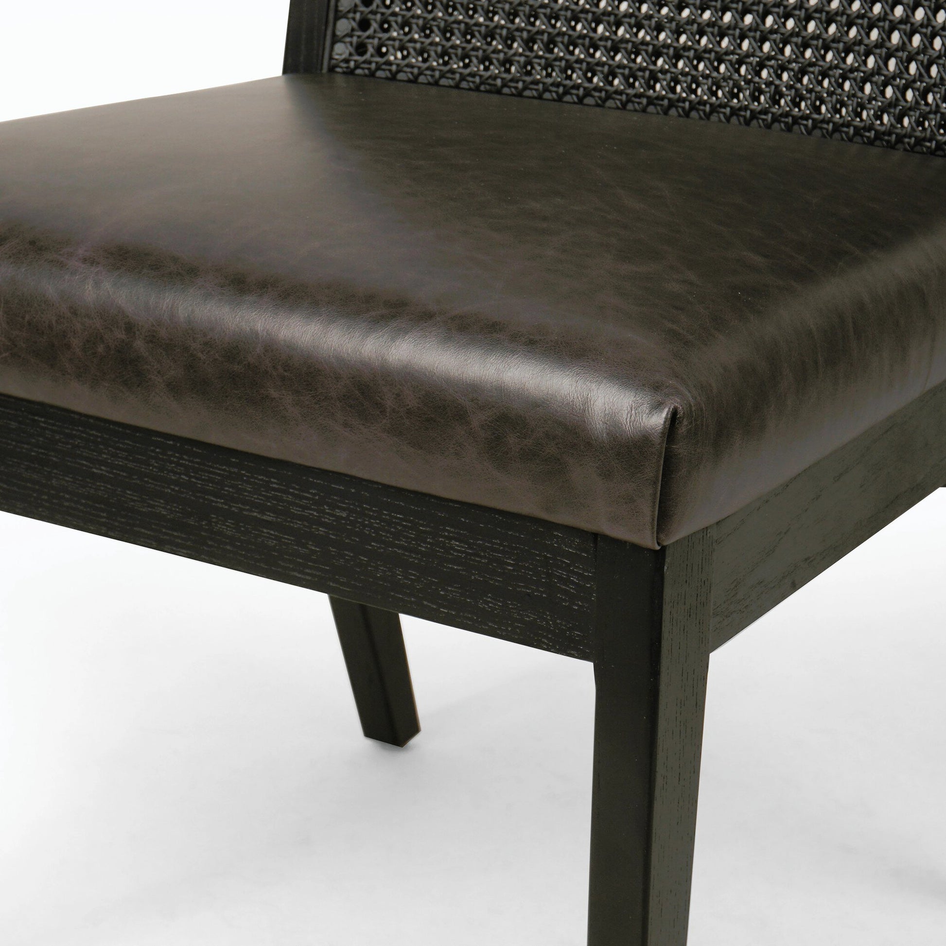 Antonia Cane Dining Chair by Four Hands in brushed ebony, sonoma black. Made from top grain leather, solid nettlewood, cane in a modern style.