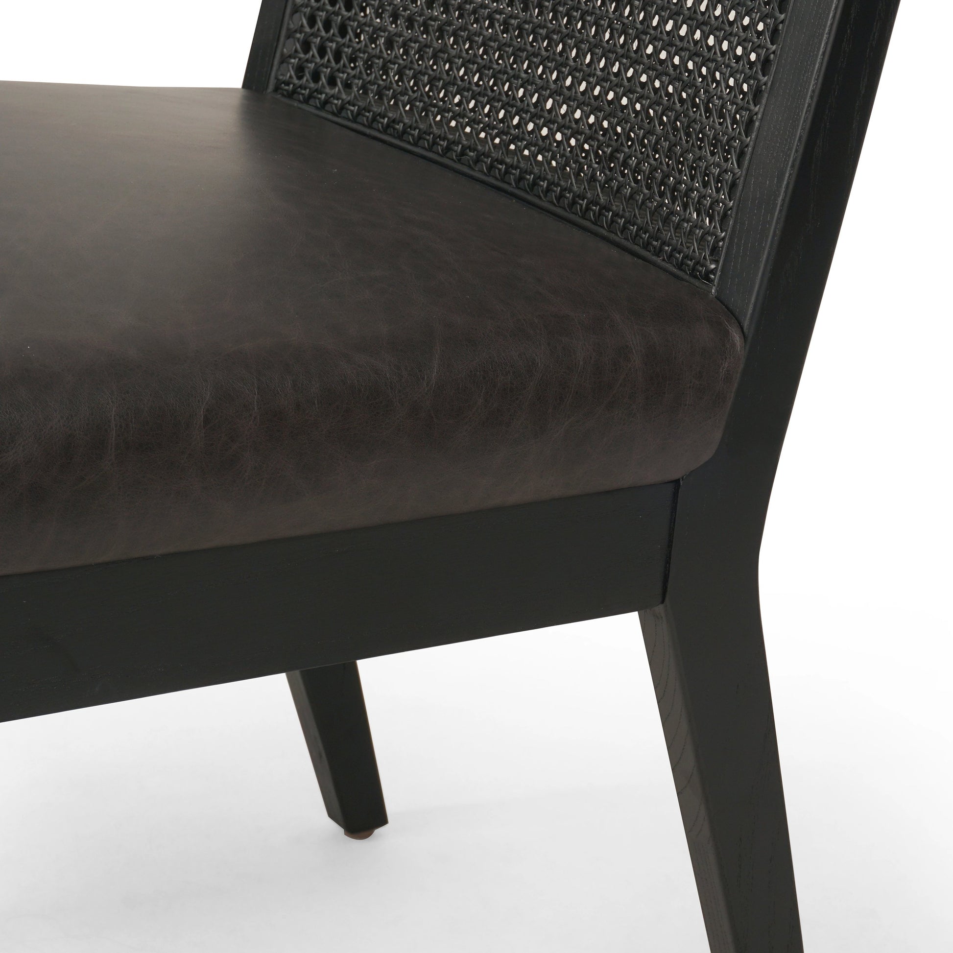 Antonia Cane Dining Chair by Four Hands in brushed ebony, sonoma black. Made from top grain leather, solid nettlewood, cane in a modern style.