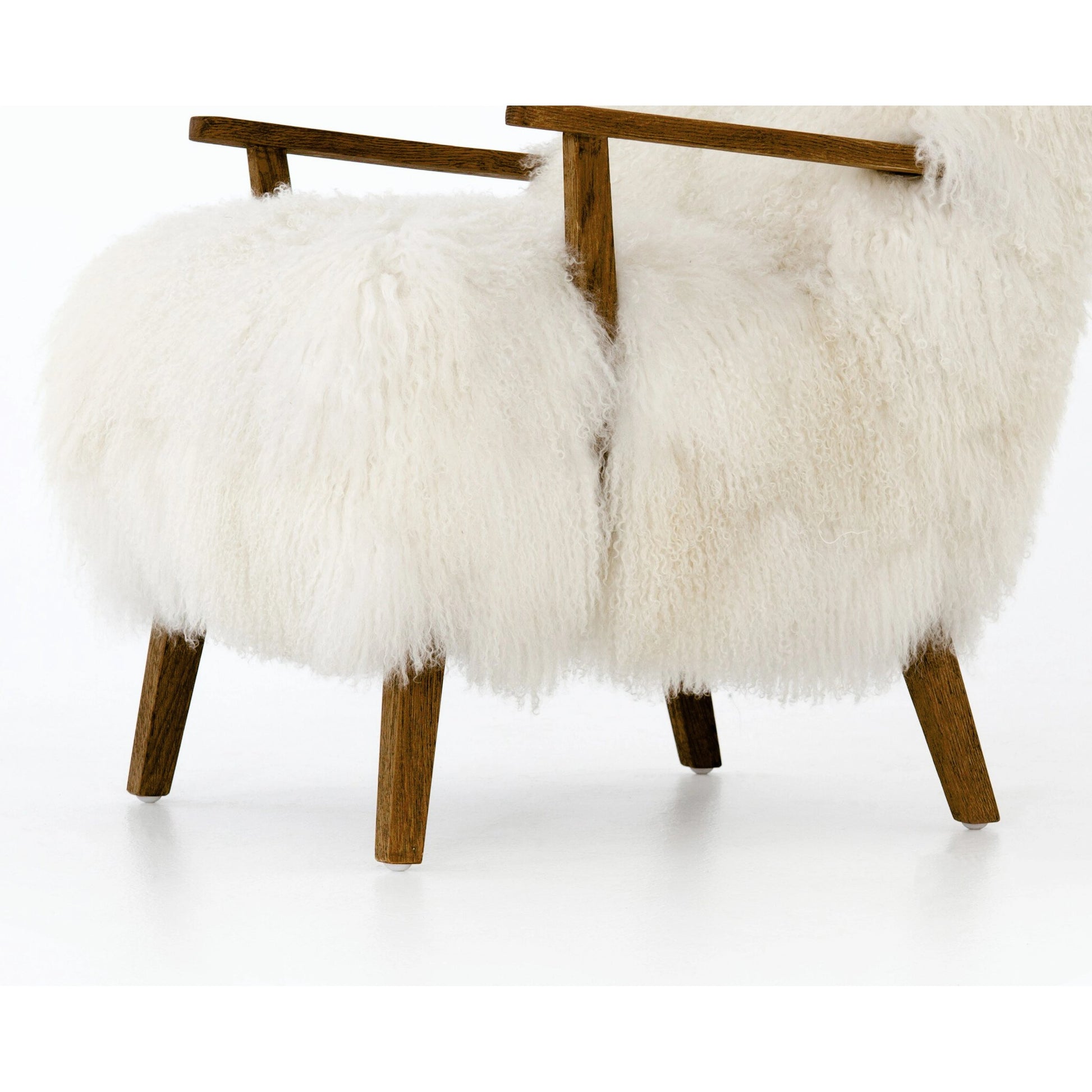 Ashland Armchair by Four Hands in mongolia cream fur, drifted oak. Made from mongolia fur, solid oak, 100% polyester in a modern style.