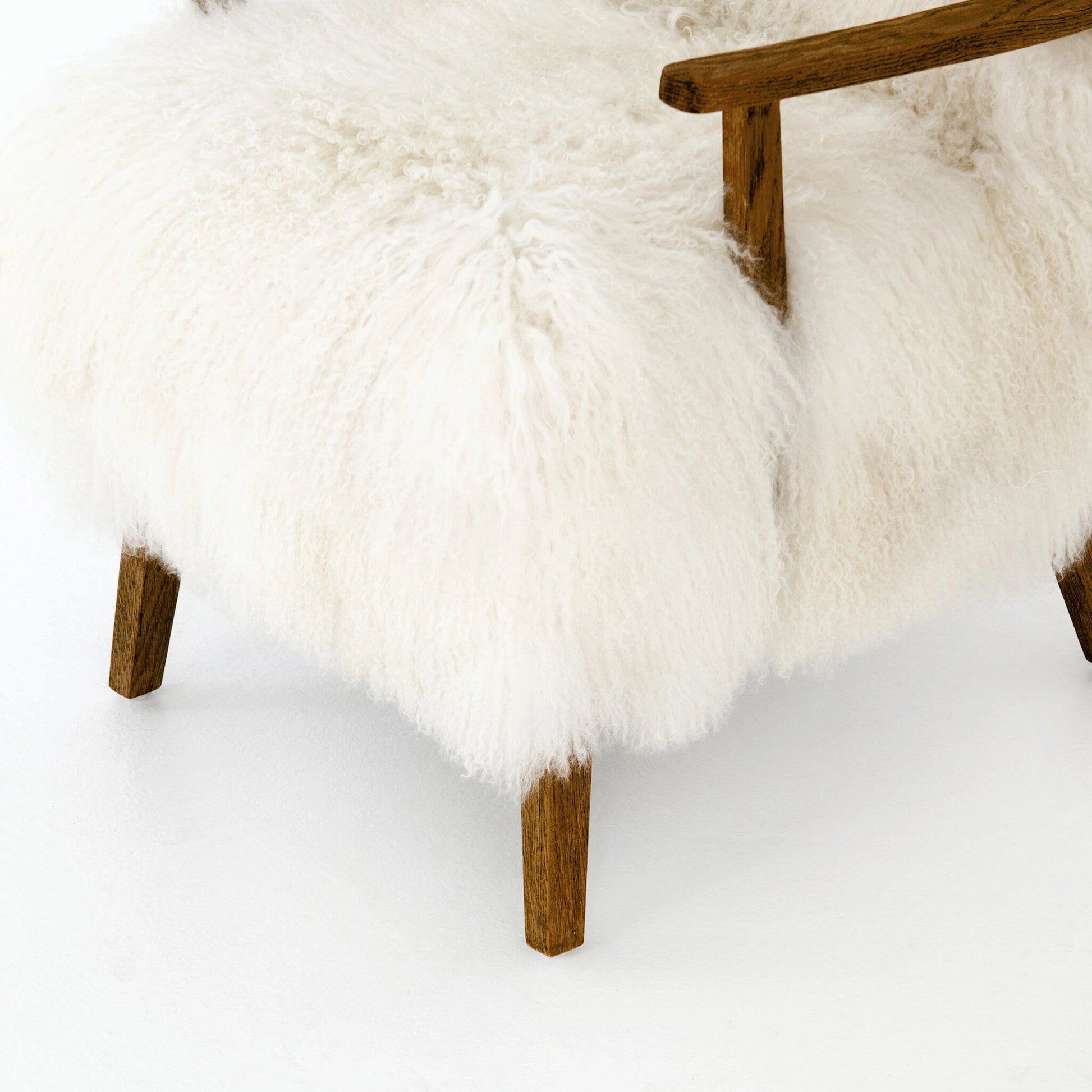 Ashland Armchair by Four Hands in mongolia cream fur, drifted oak. Made from mongolia fur, solid oak, 100% polyester in a modern style.