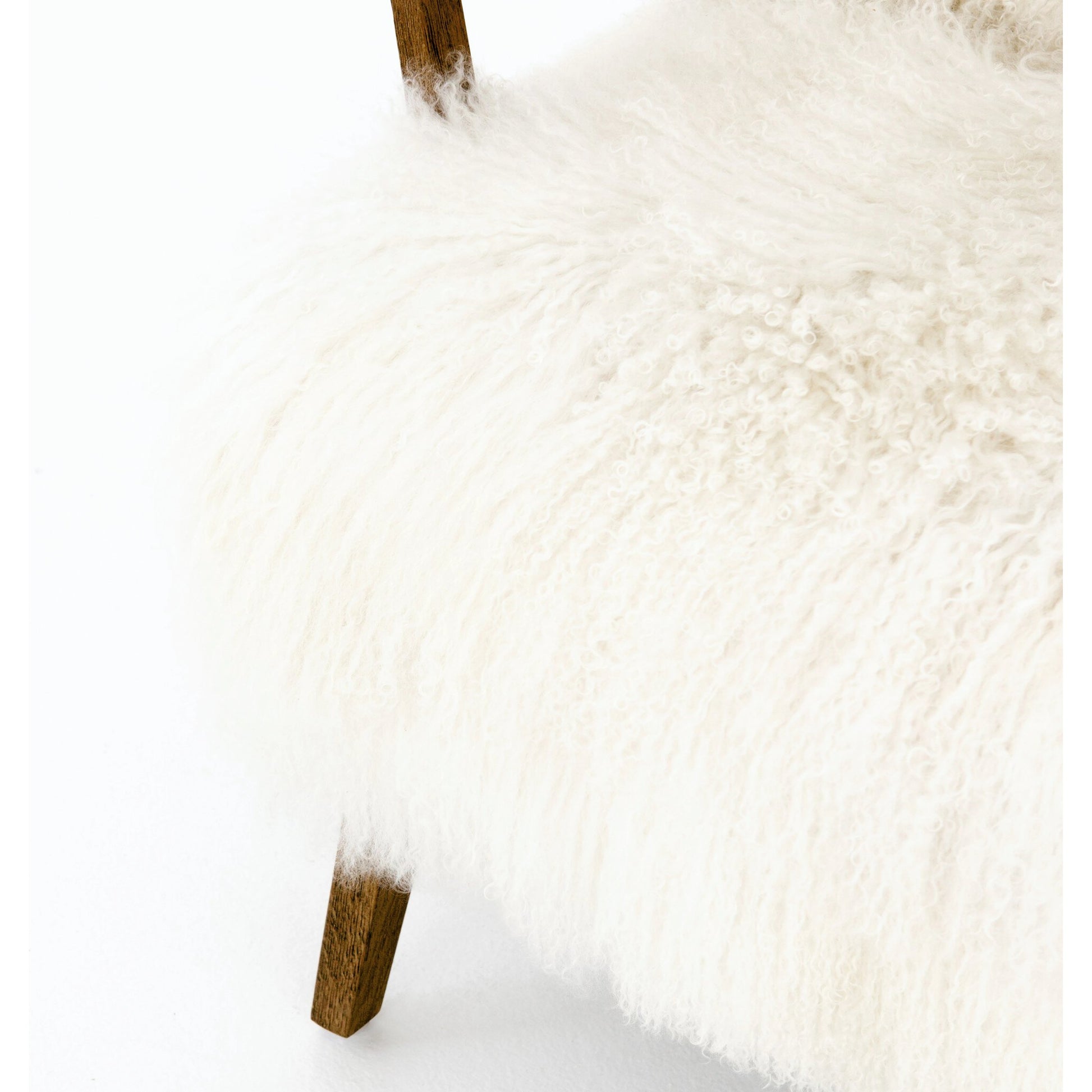 Ashland Armchair by Four Hands in mongolia cream fur, drifted oak. Made from mongolia fur, solid oak, 100% polyester in a modern style.