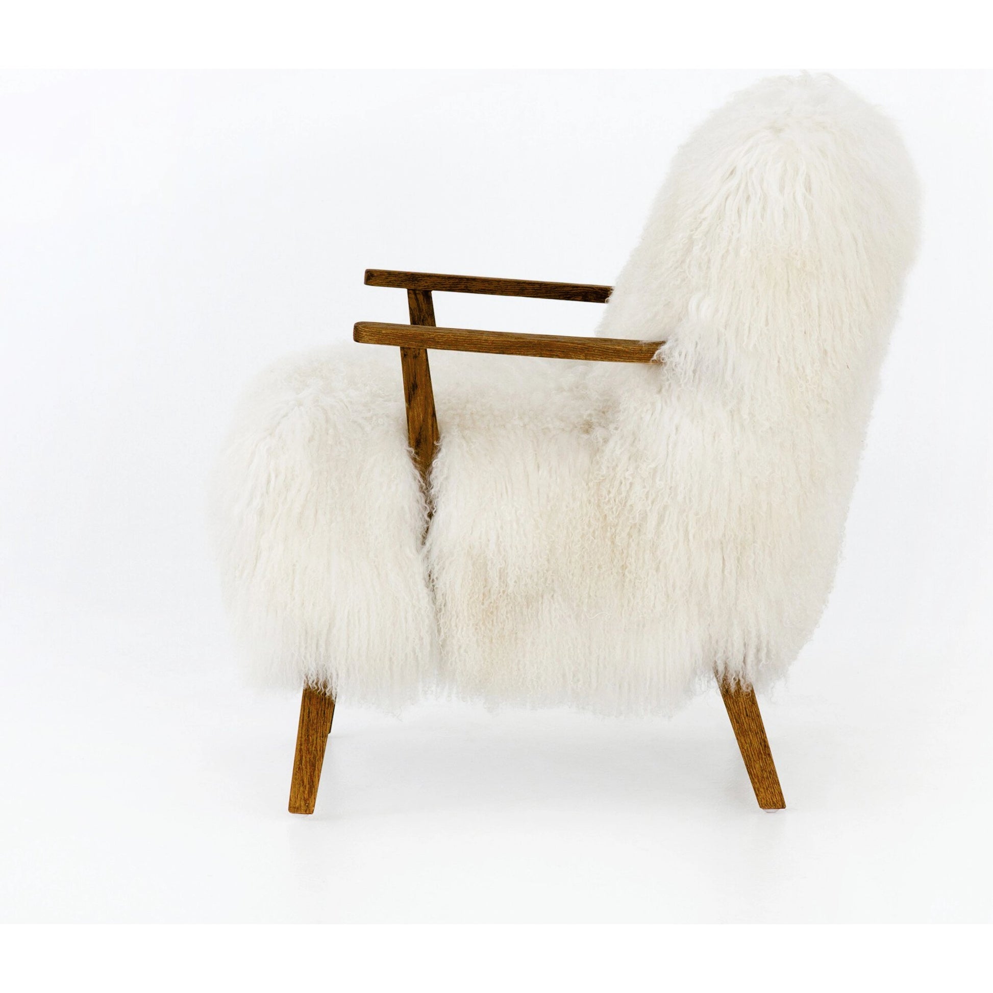 Ashland Armchair by Four Hands in mongolia cream fur, drifted oak. Made from mongolia fur, solid oak, 100% polyester in a modern style.