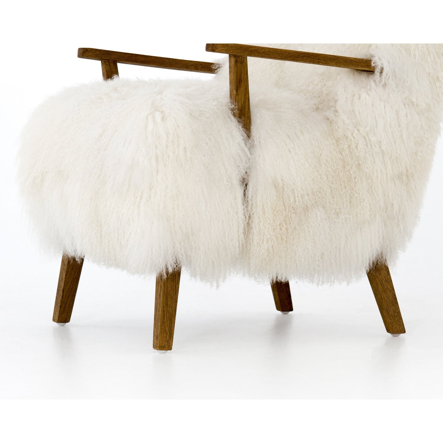 015 SI-1797380 | Closeup | Ashland Armchair by Four Hands in mongolia cream fur, drifted oak. Made from mongolia fur, solid oak, 100% polyester in a modern style.