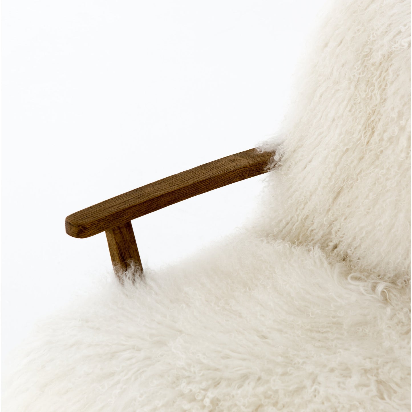 019 SI-1797380 | Closeup | Ashland Armchair by Four Hands in mongolia cream fur, drifted oak. Made from mongolia fur, solid oak, 100% polyester in a modern style.