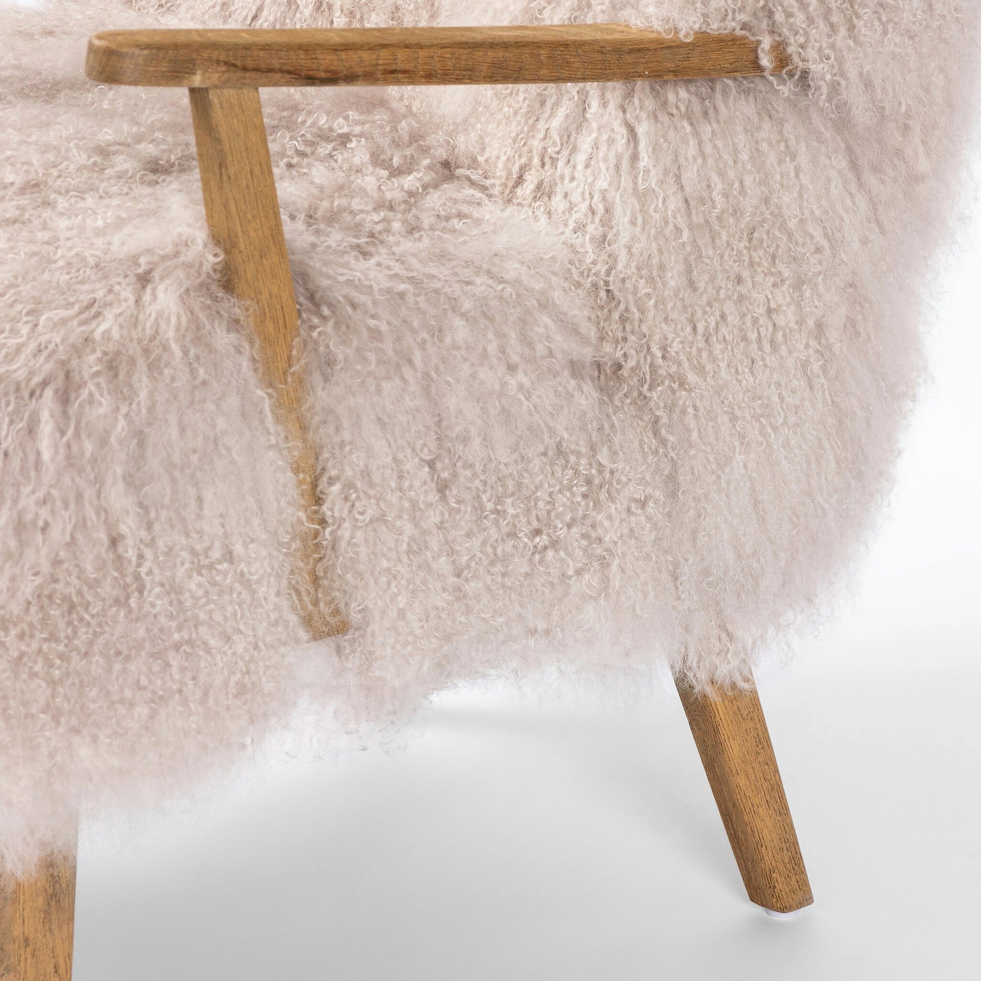 Ashland Armchair by Four Hands in mongolia cream fur, drifted oak. Made from mongolia fur, solid oak, 100% polyester in a modern style.