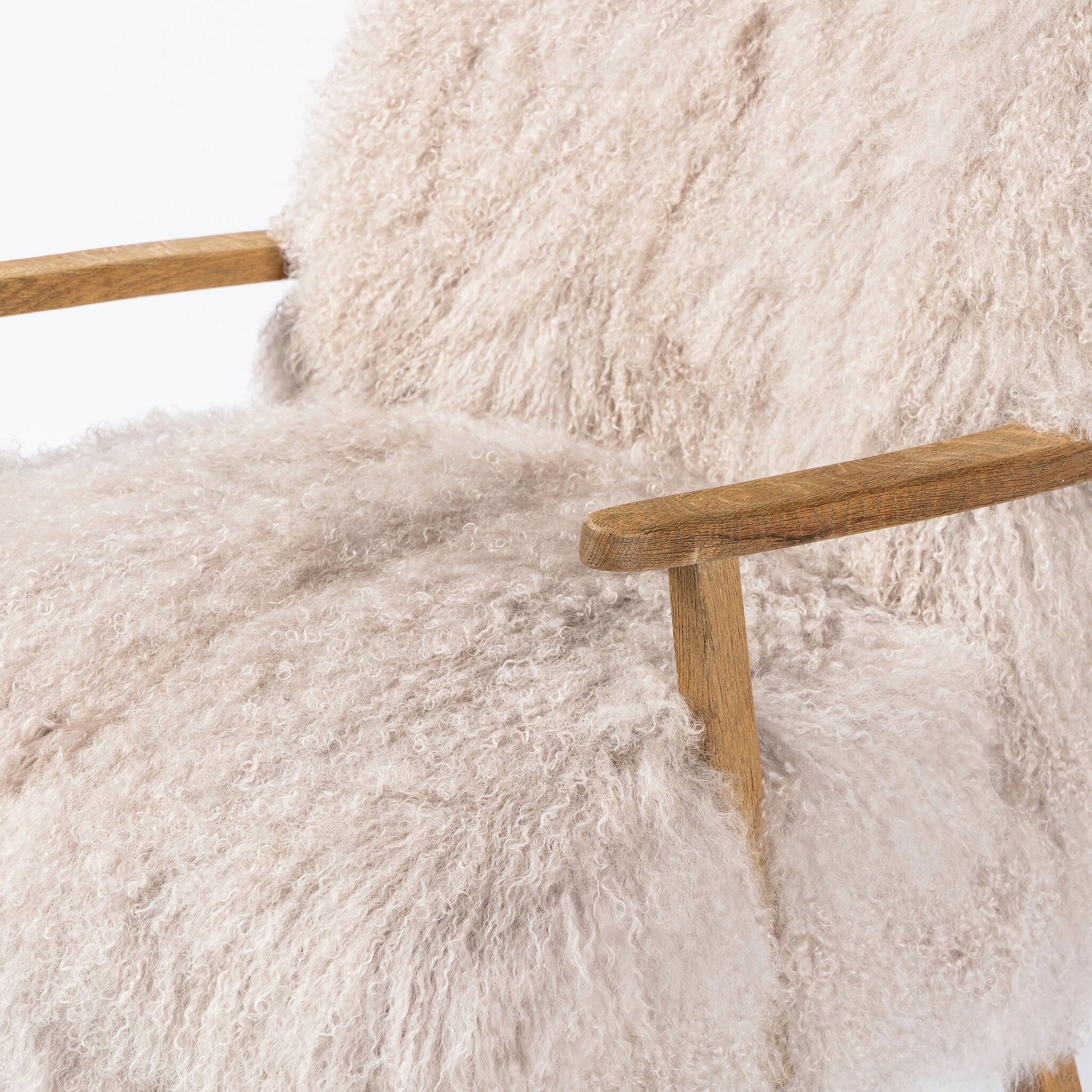 Ashland Armchair by Four Hands in mongolia cream fur, drifted oak. Made from mongolia fur, solid oak, 100% polyester in a modern style.