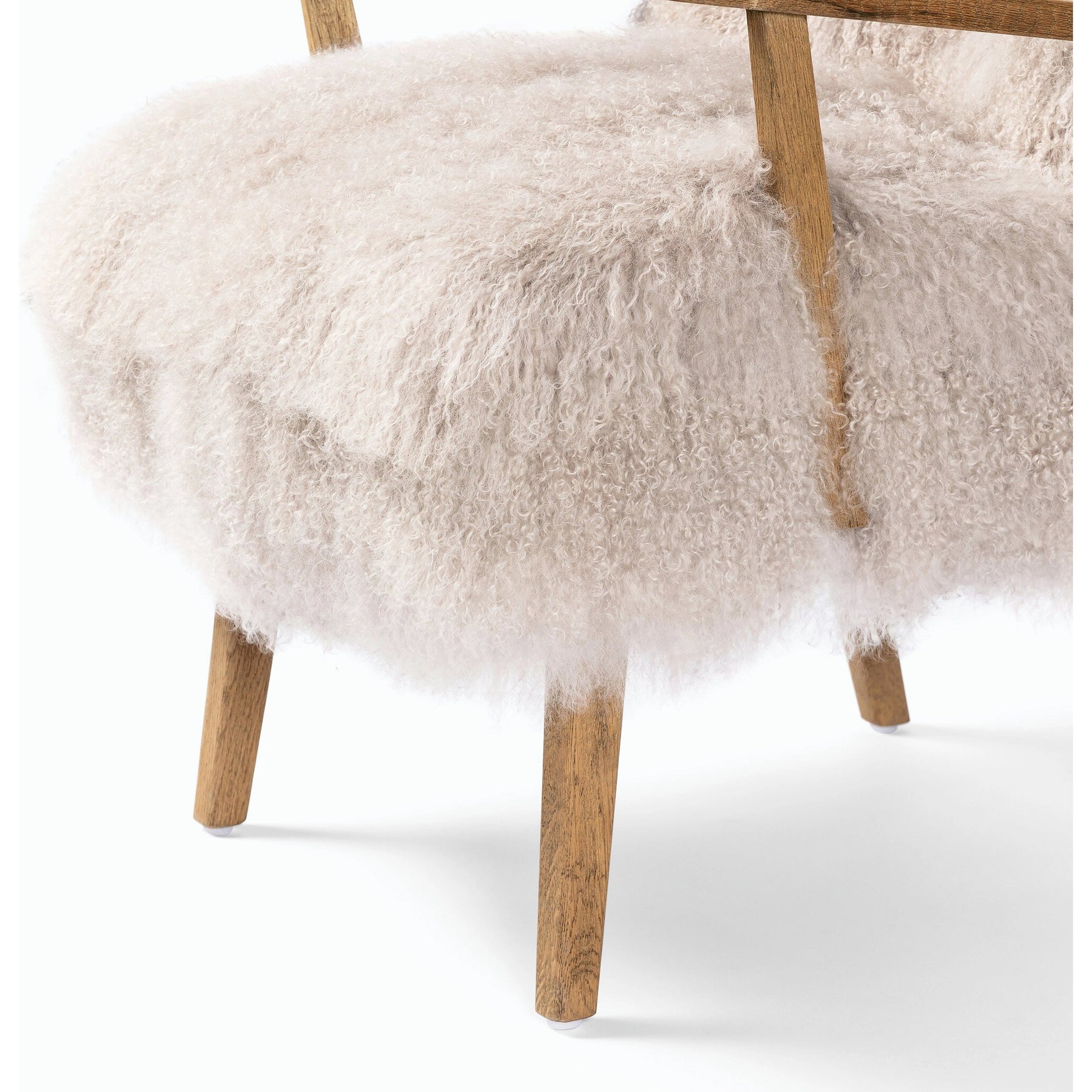 Ashland Armchair by Four Hands in mongolia cream fur, drifted oak. Made from mongolia fur, solid oak, 100% polyester in a modern style.