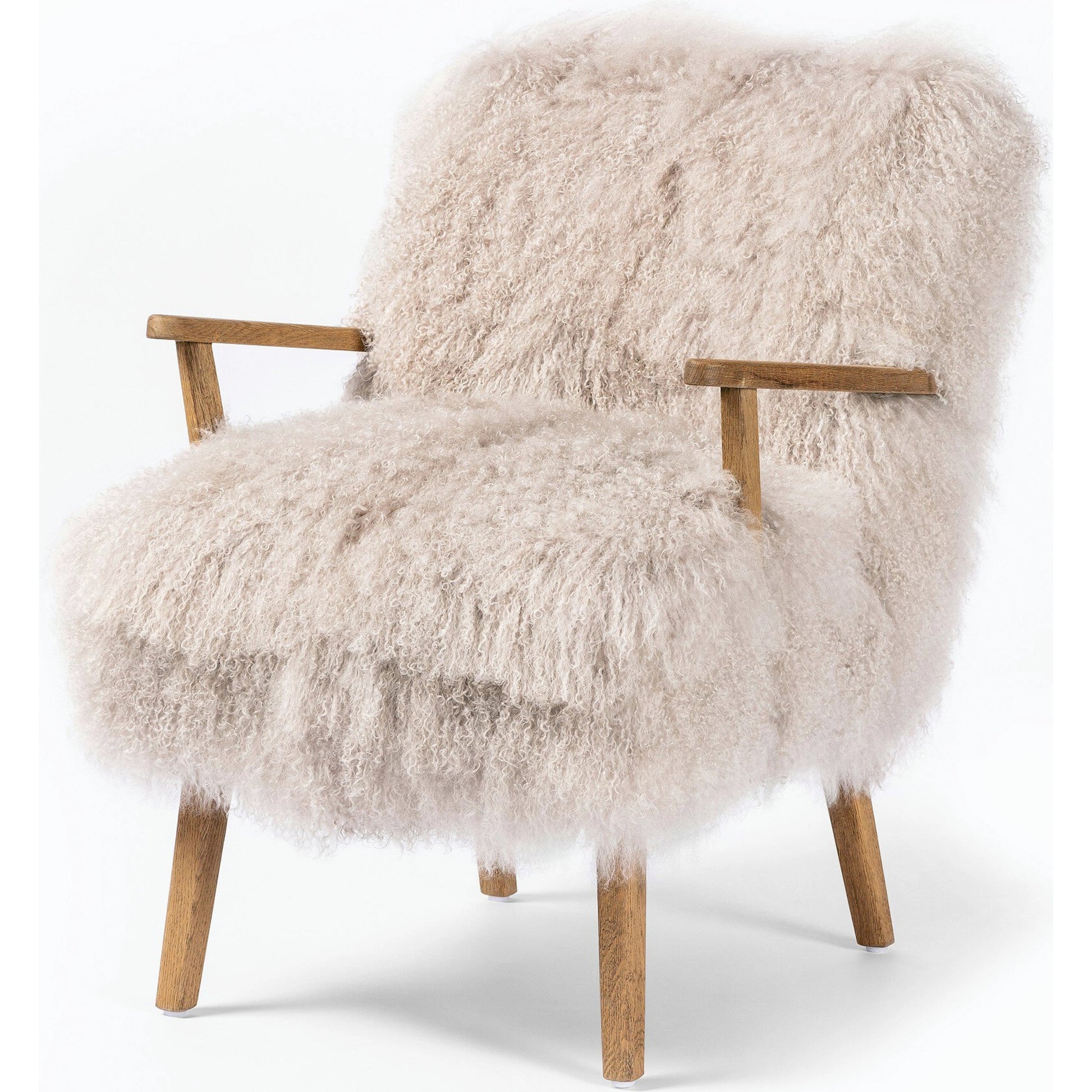 Ashland Armchair by Four Hands in mongolia cream fur, drifted oak. Made from mongolia fur, solid oak, 100% polyester in a modern style.